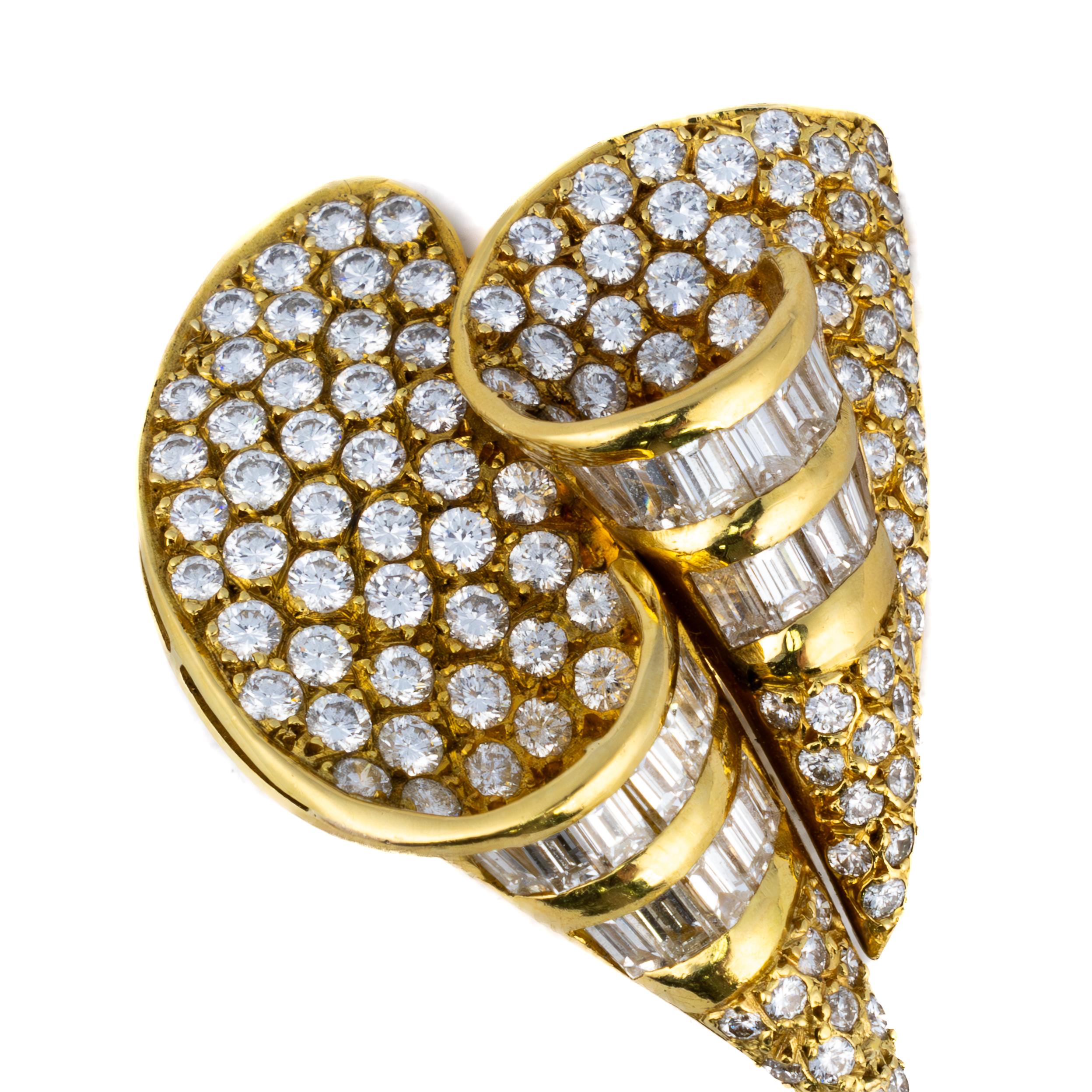 Diamond and Pearl Convertible Day & Night Earrings

Description:
A striking pair of convertible earrings, designed with a dramatic swirl of pavé and baguette-cut diamonds leading to detachable cultured pearls. These versatile earrings offer two