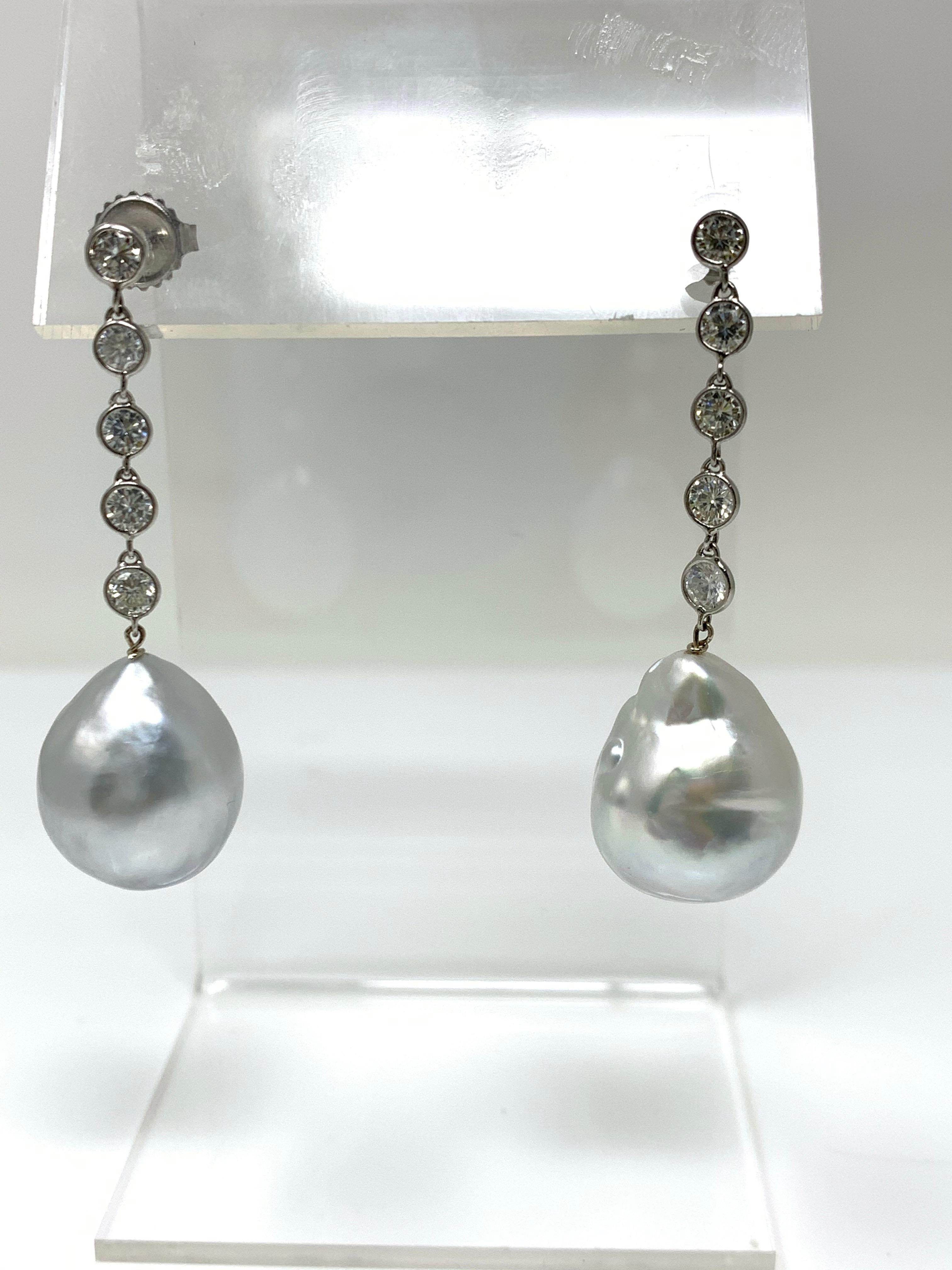 Moguldiam Inc's Diamond and pearl earrings are custom handmade in platinum. 
The diamonds are bezel set in these earrings. 
Diamond weight : 1.50 carat 
Metal : Platinum 
Measurements : 1 3/4 inches long 