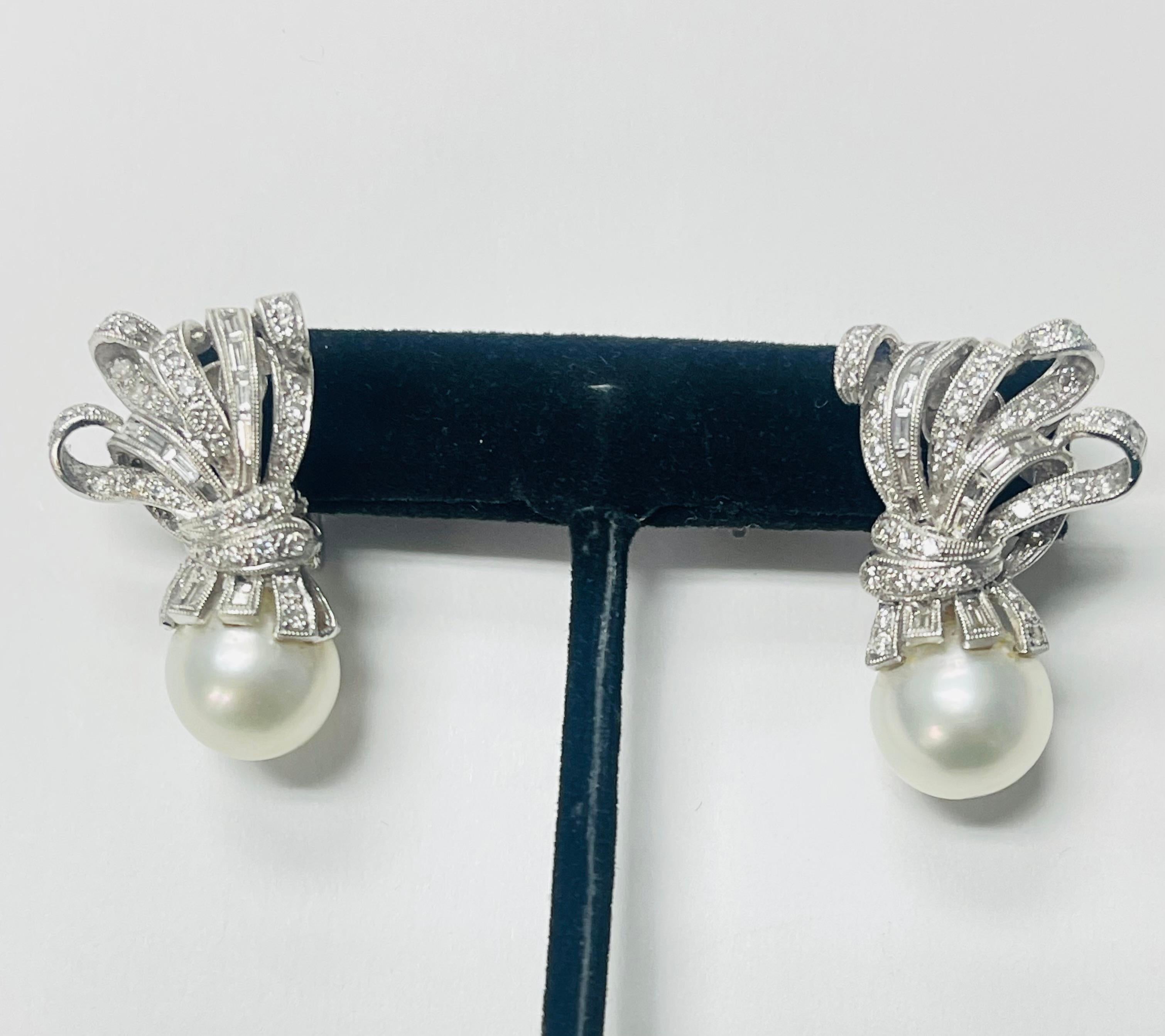 Very Pretty pearl and diamond clip on earrings in Platinum. 

The details are as follows ; 

Diamond weight : 2.42 carats 
Pearl : 12.6mm each 
Metal Platinum 
