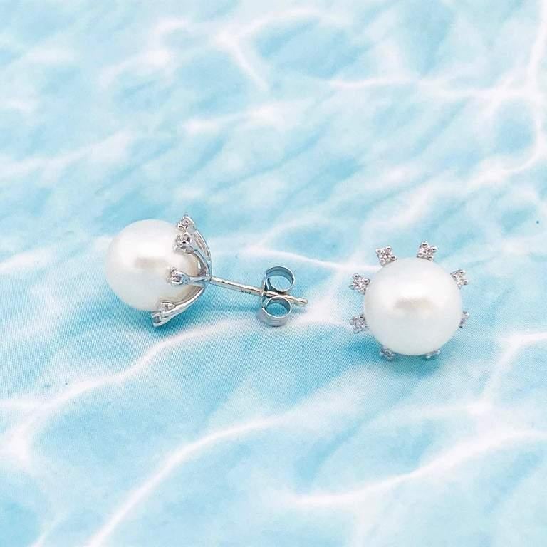 The pearls have a very thick nacre, beautiful luster and they are symmetrical and perfectly round. With a natural white pearl color these pearls are amazing quality. 
THESE EARRINGS ARE MADE TO ORDER! It takes our jewelers 4 weeks to make the
