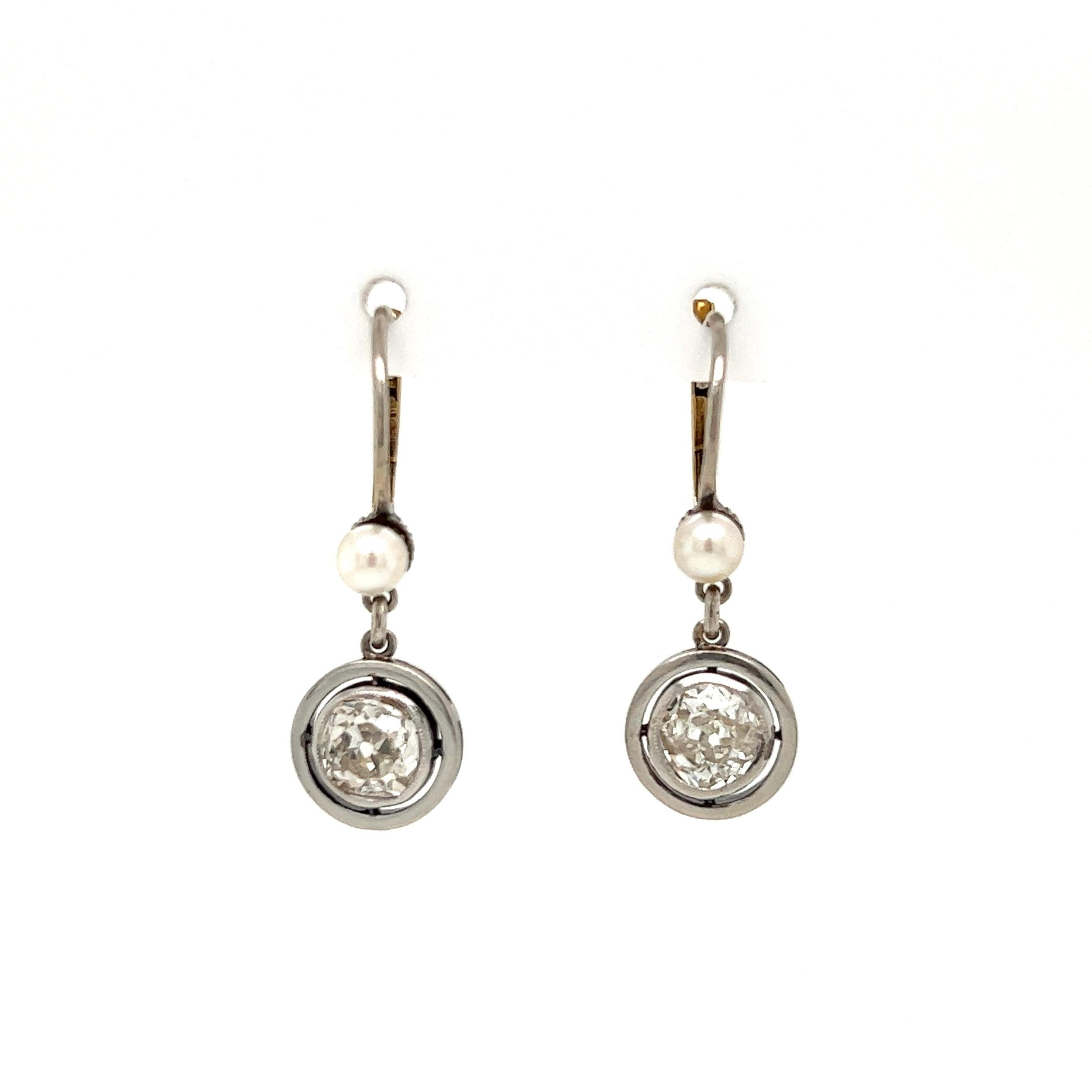 Diamond and Pearl Double Drop Platinum and Gold Earrings Fine Estate Jewelry
Simply Beautiful! Finely detailed Double Drop Platinum Earrings. Bezel set with Diamonds weighing approx.1.20tcw, Color K; clarity: SI1/SI2. Each earring suspended from a