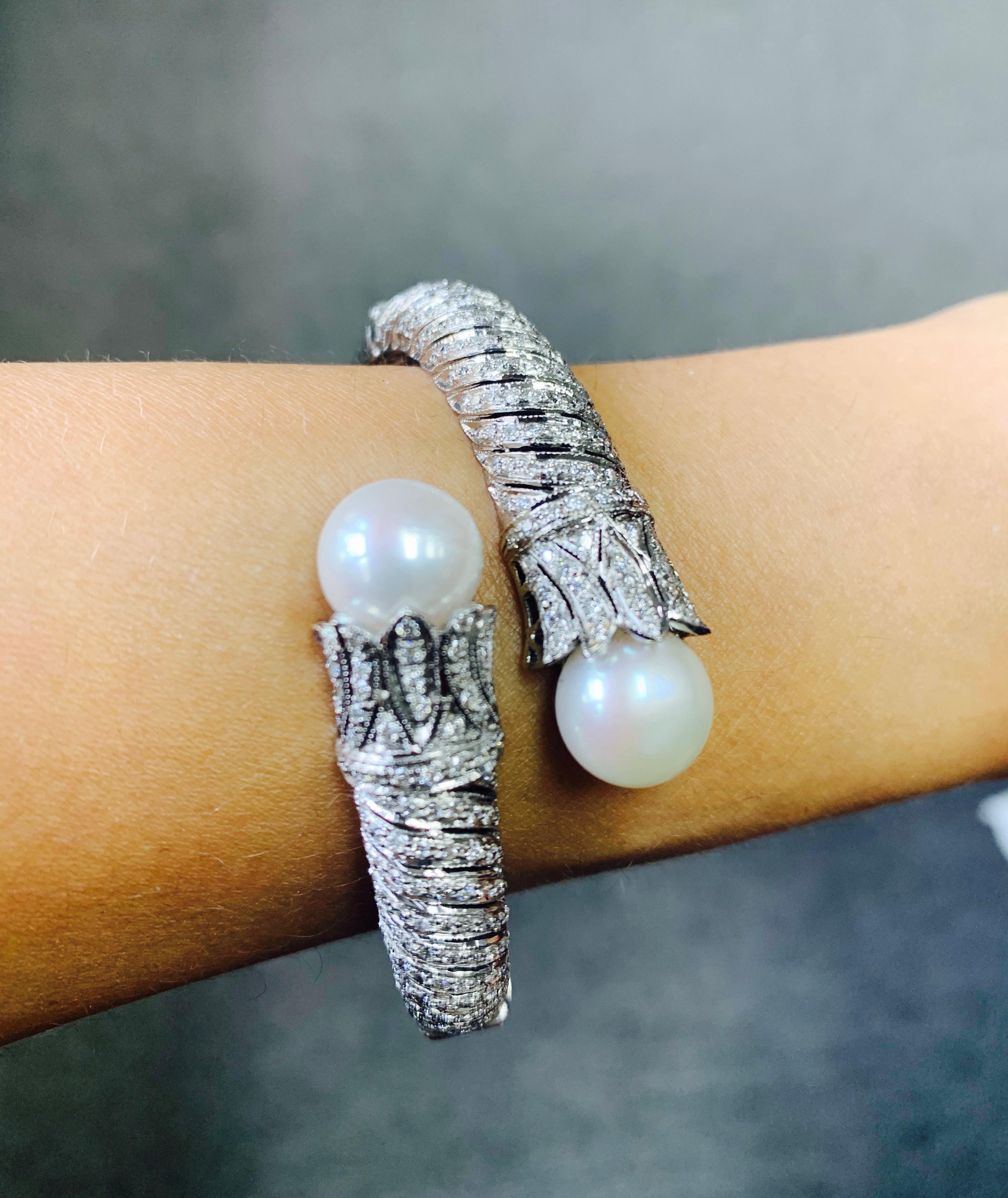 This Gorgeous handmade flexible bangle is handcrafted in 18 K white gold. 
The details are as follows : 
Diamond weight : 2.20 carat ( GH color and VS clarity ) 
Metal : 18k white gold 
Gold weight : 49.600 grams 
Measurements : outside dimensions :