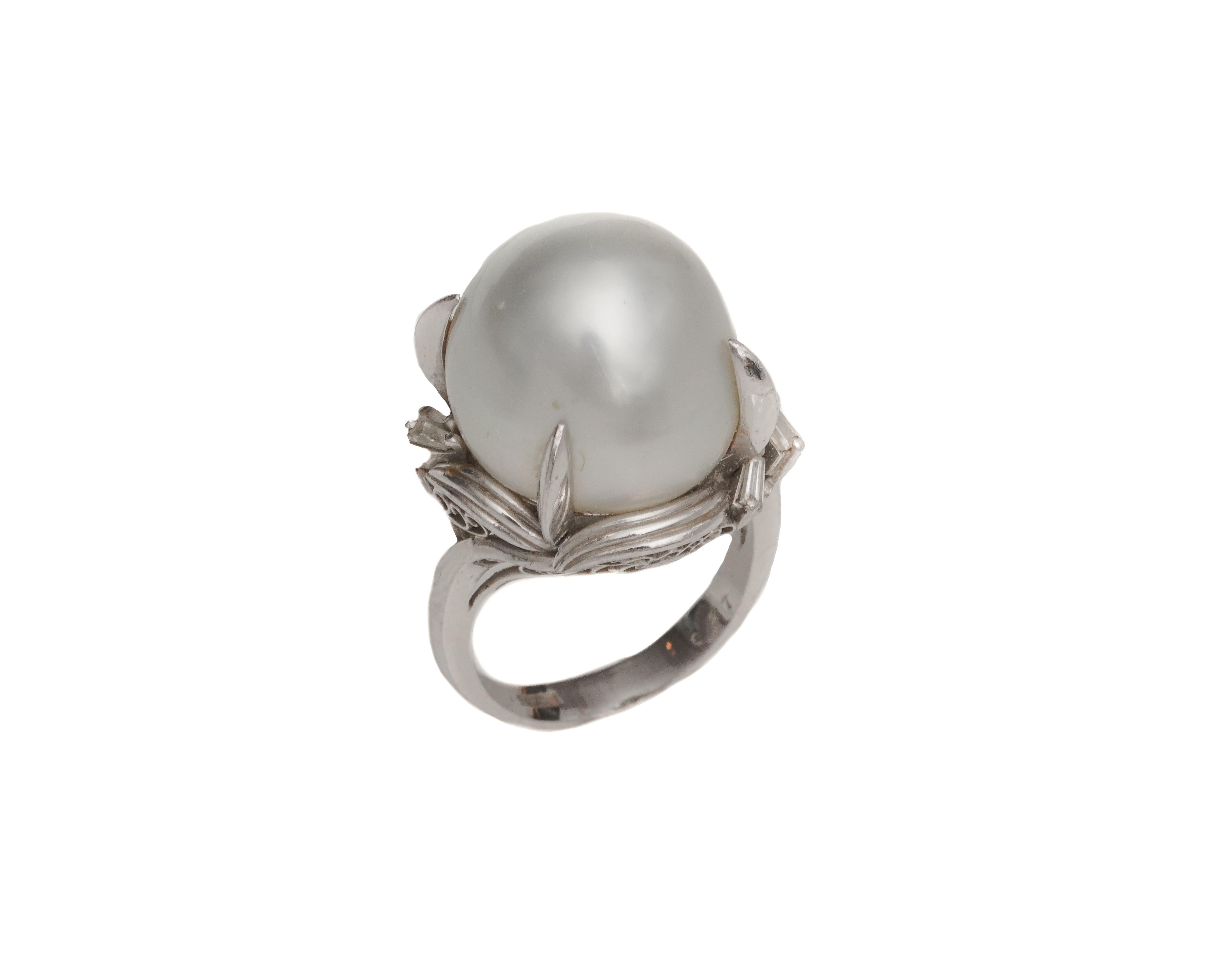 Ring Details:
Metal type: Platinum
Weight: 15.7 grams
Size: 6 (resizable)

Pearl Details:
Cone Shape
Measures 16 millimeter wide x 18 millimeter length 

Diamond Details:
Cut: Round
Carat: .05 Carats
Color: F
Clarity: VS

Gorgeous Pearl is held in