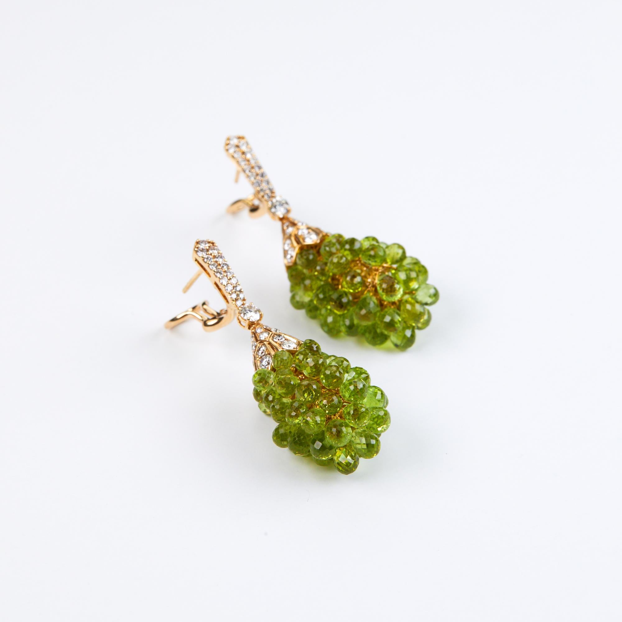 Diamond and Peridot Chandlier Earrings with 56.05 carats of Briolette cut Peridots.  Peridot is one of the oldest known gemstones with mining records dating back to 1500 BC.  The Briolette cut is an elongated pear shape cut with triangular and