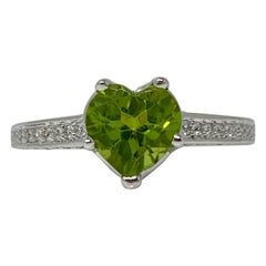 Diamond and Peridot Engagement Ring in 18 Karat White Gold