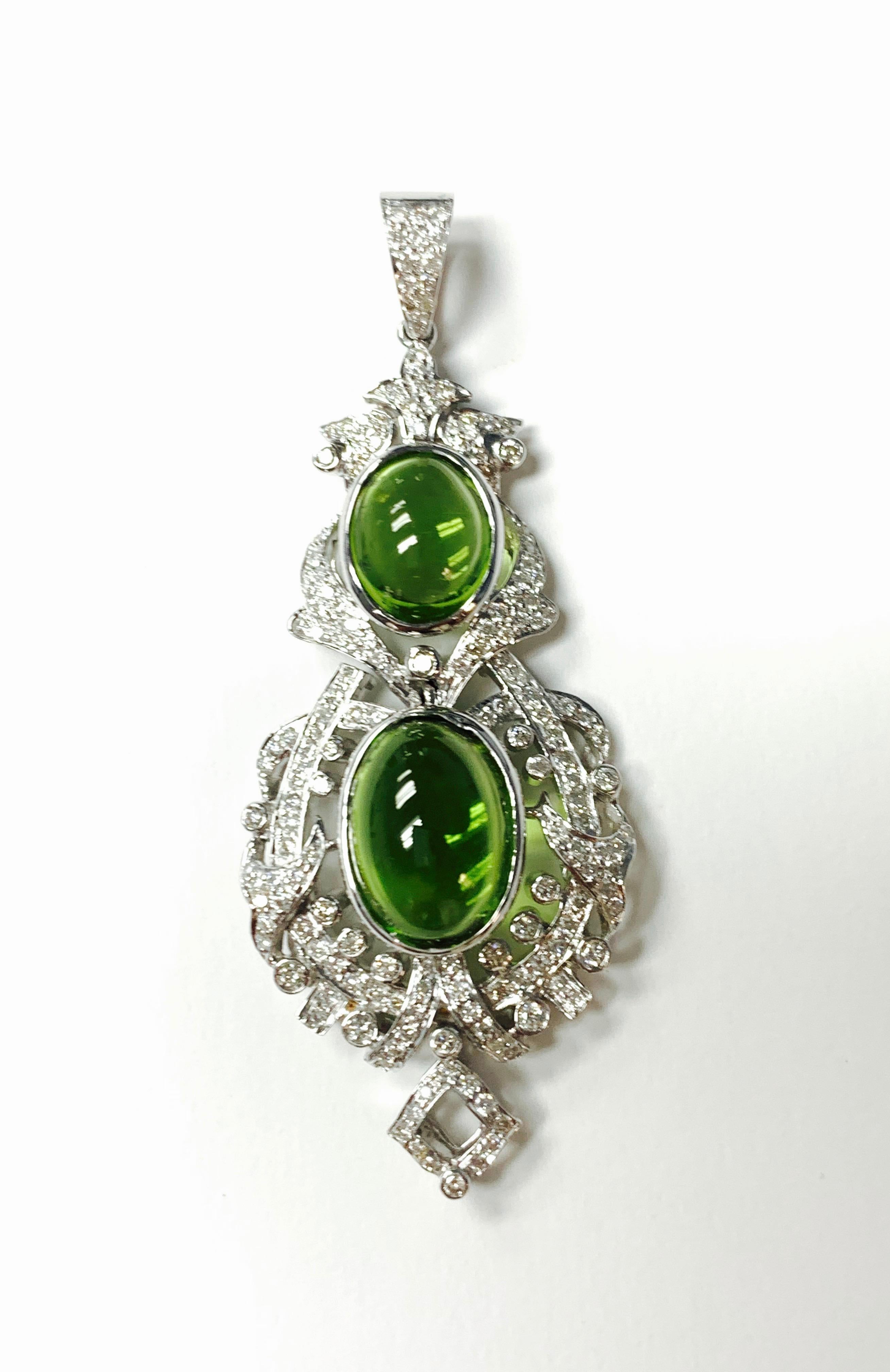 Beautiful Diamond and peridot pendant handcrafted in 18K white gold. 
The details are as follows: 
Diamond weight : 1 carat approx ( GH color and VS clarity ) 
Peridot weight : 8.64 carat
Measurements : 2.50 inches long 

