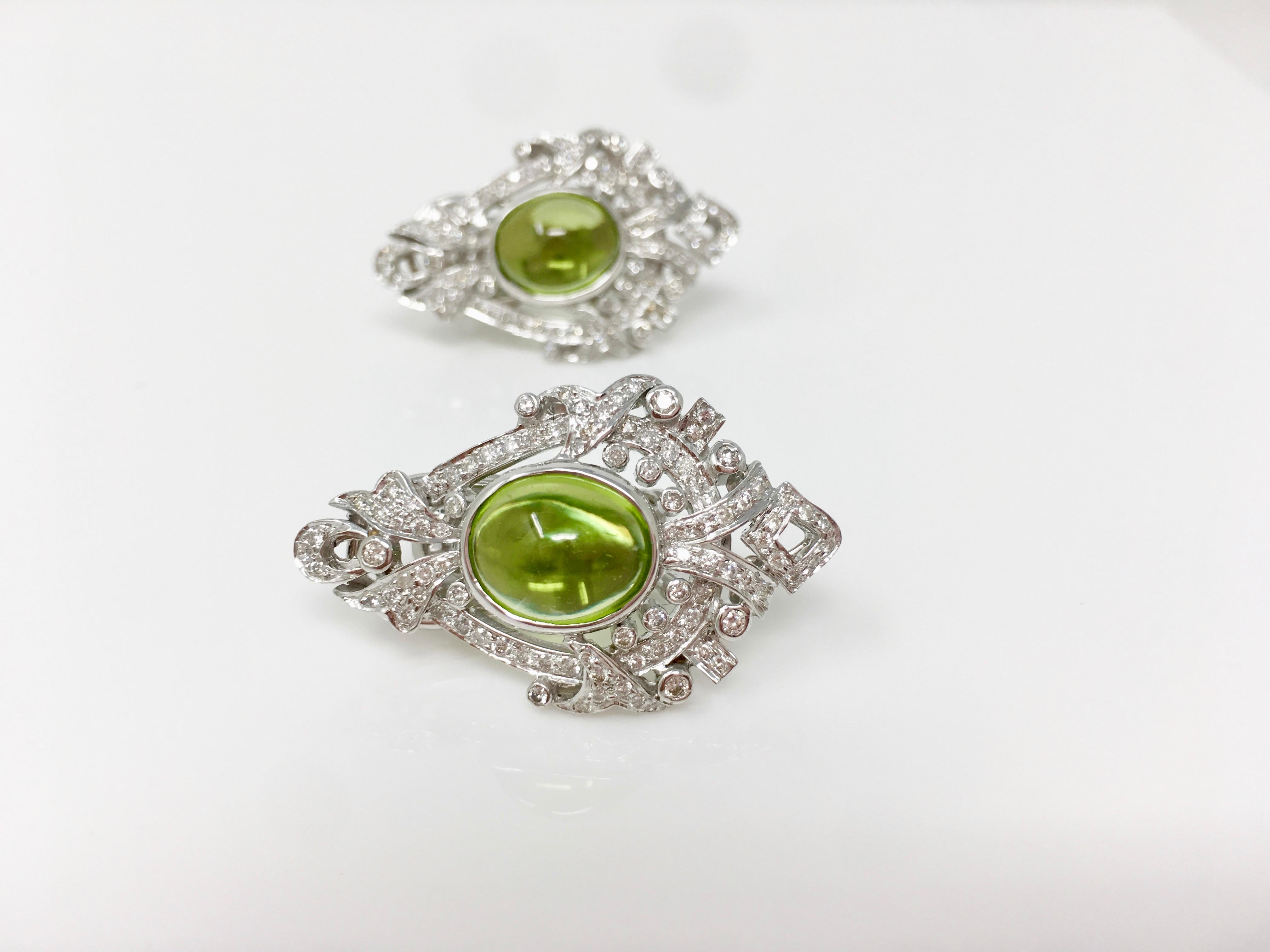 Diamond and peridot stud earrings handmade in 18K white gold.
The details are as follows : 
Diamond weight : 1.52 carat approx ( GH color and VS clarity ) 
Peridot weight : 8.70 carat approx
Measurements : 1.30inches long and 1 inch wide 
Metal :