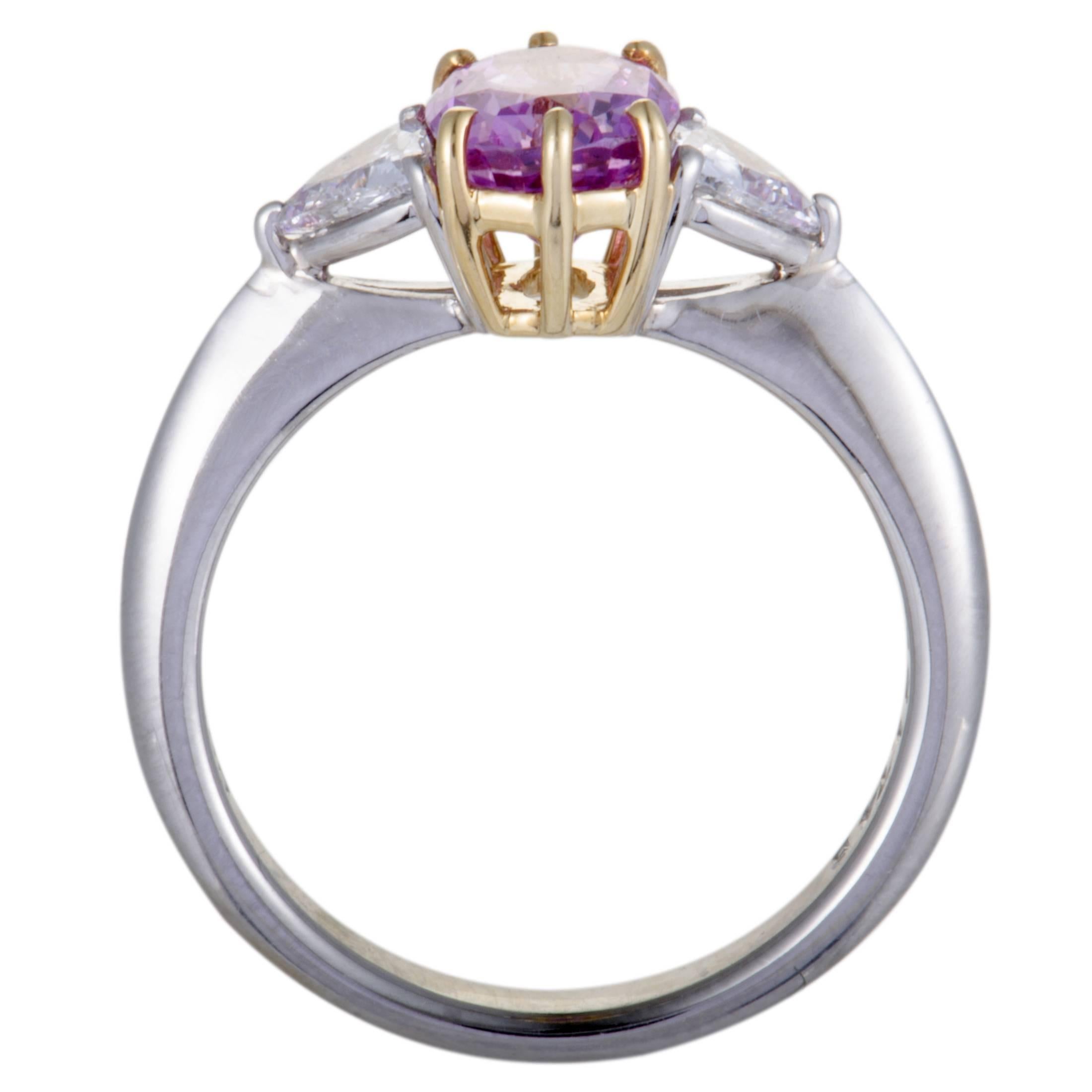 This sensational ring is beautifully designed in a gorgeous combination of 18K yellow gold and platinum. The ring displays an exquisitely charming appeal with its extravagant embellishment of .41ct of diamonds and a spectacular 1.74ct pink sapphire