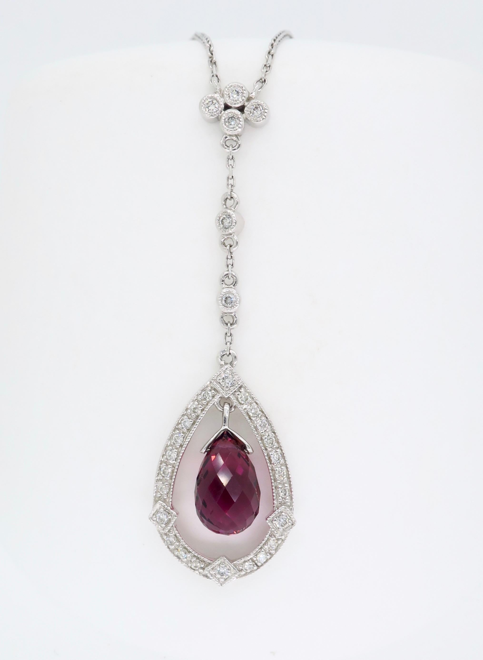 This elegant pendant features a beautiful briolette cut pink tourmaline surrounded by .22CTW of diamonds.

Pink Tourmaline & Diamond
Gemstone Carat Weight: 2.43CT Briolette Cut Pink Tourmaline
Diamond Carat Weight: .22CTW
Diamond Cut: Round