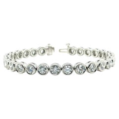 Diamond and Platinum Bezel Tennis Bracelet, 6.96 Carats Total, 6.25 Inches
