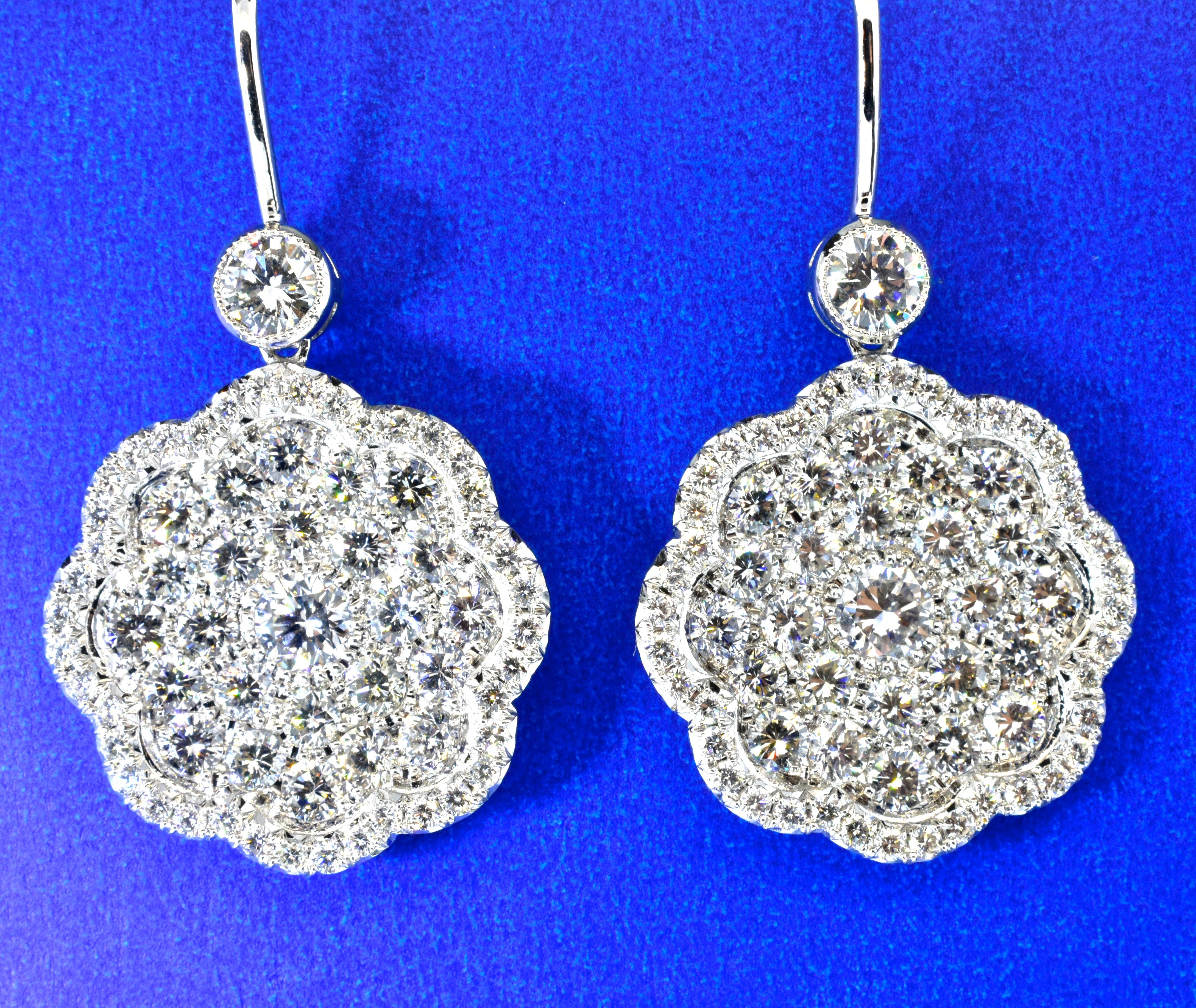 Diamonds are pave set, fine white, well matched and well cut stones.  They are all G/H, VS quality.  The total diamond weight is 4.49 cts.
These earrings are hand made displaying fine craftsmanship.  They are now for a pierced ear, but can be