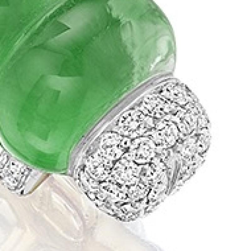 Layering rock crystal over a colored gem, Vhernier's caterpillar comes to life with a plump vivid green jade and rock crystal body.
There are 18 diamond feet and a pave diamond head.  Circa Modern.

Signed, Vhernier. 