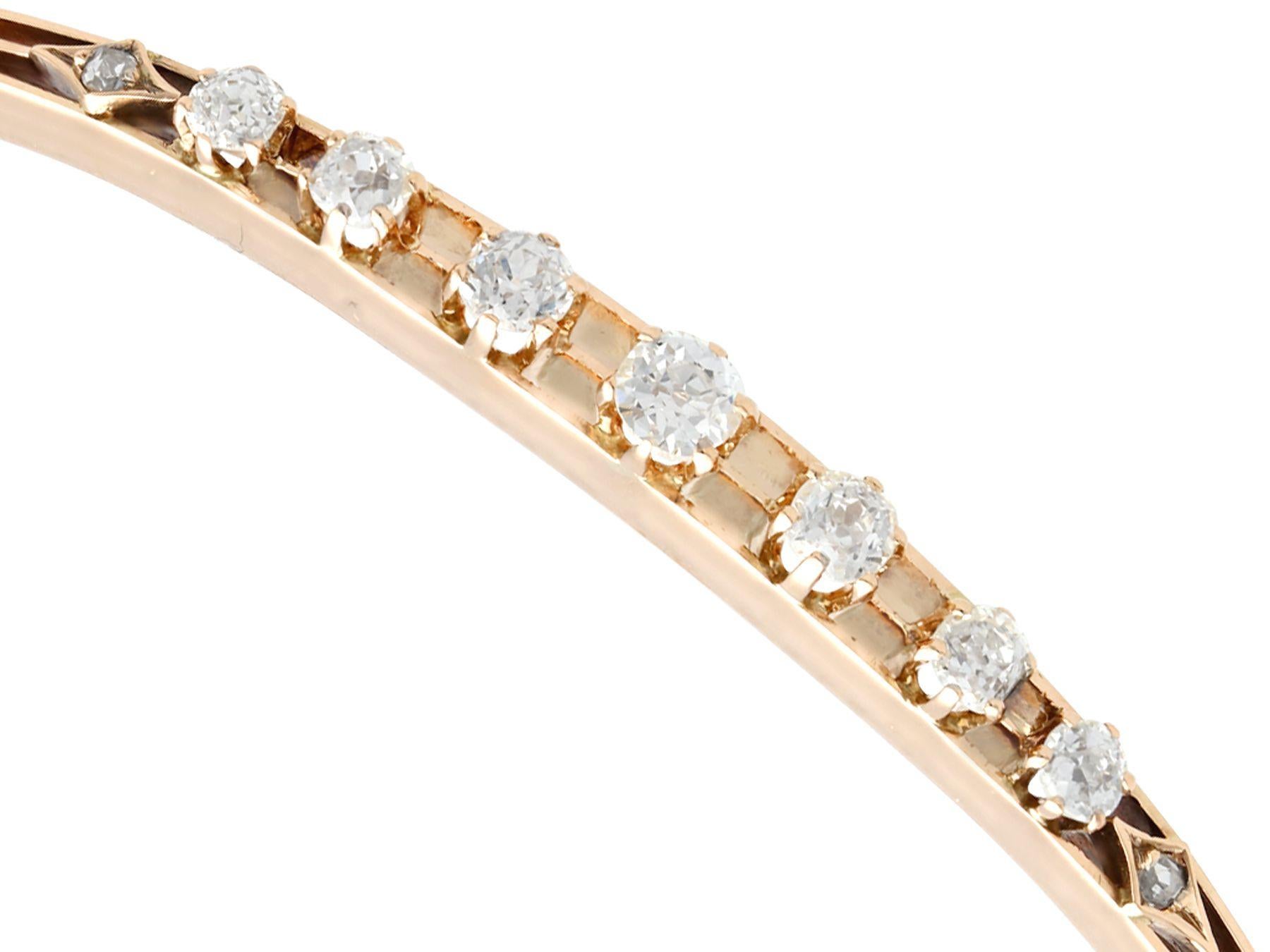 A fine and impressive antique 0.99 carat diamond and 14 karat rose gold bangle; part of our diverse antique jewelry collections

This fine and impressive antique bangle has been crafted in 14k rose gold.

The hinged bangle is ornamented with a