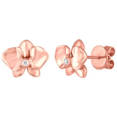 Clous d'oreilles fleurs en or rose et diamants