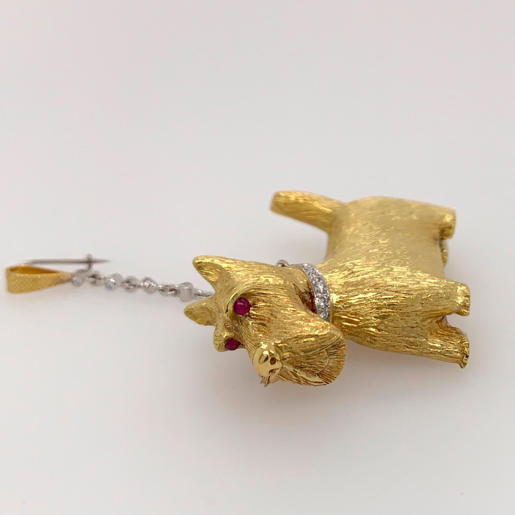 18K yellow and white gold Scottie dog brooch with 2 pins, one for the leash and one for the pooch! Designed and fabricated by E. Wolfe & Co. The white gold leash and collar have a total of 14 brilliant cut diamonds with a total weight of 0.32 cts.