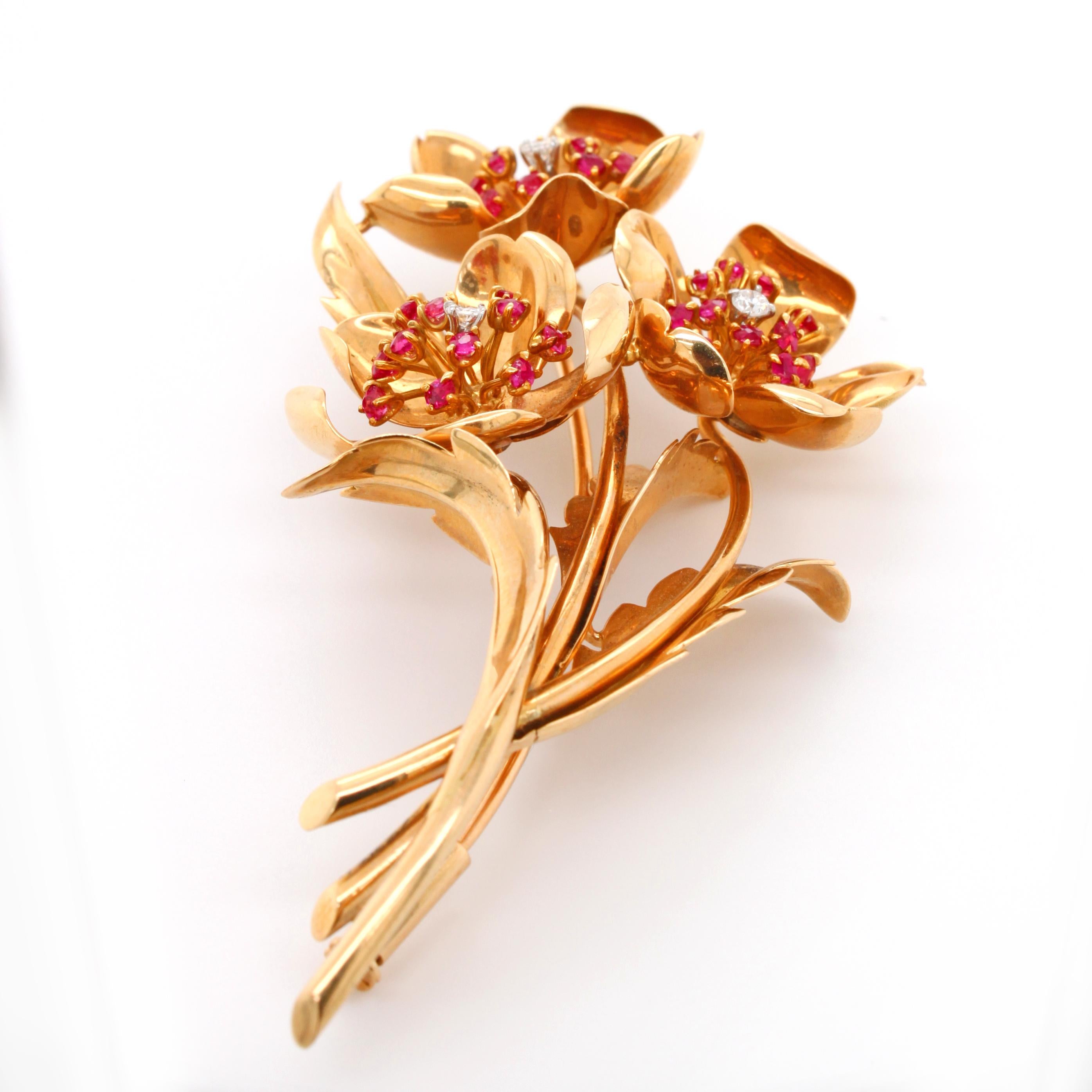 A beautiful brooch in the form of a buttercup flower realistically made in yellow gold. The pistil and stamen are set with diamonds and rubies. The brooch has the 18k gold stamp and makers marks.

The buttercup flower is a joyful flower and