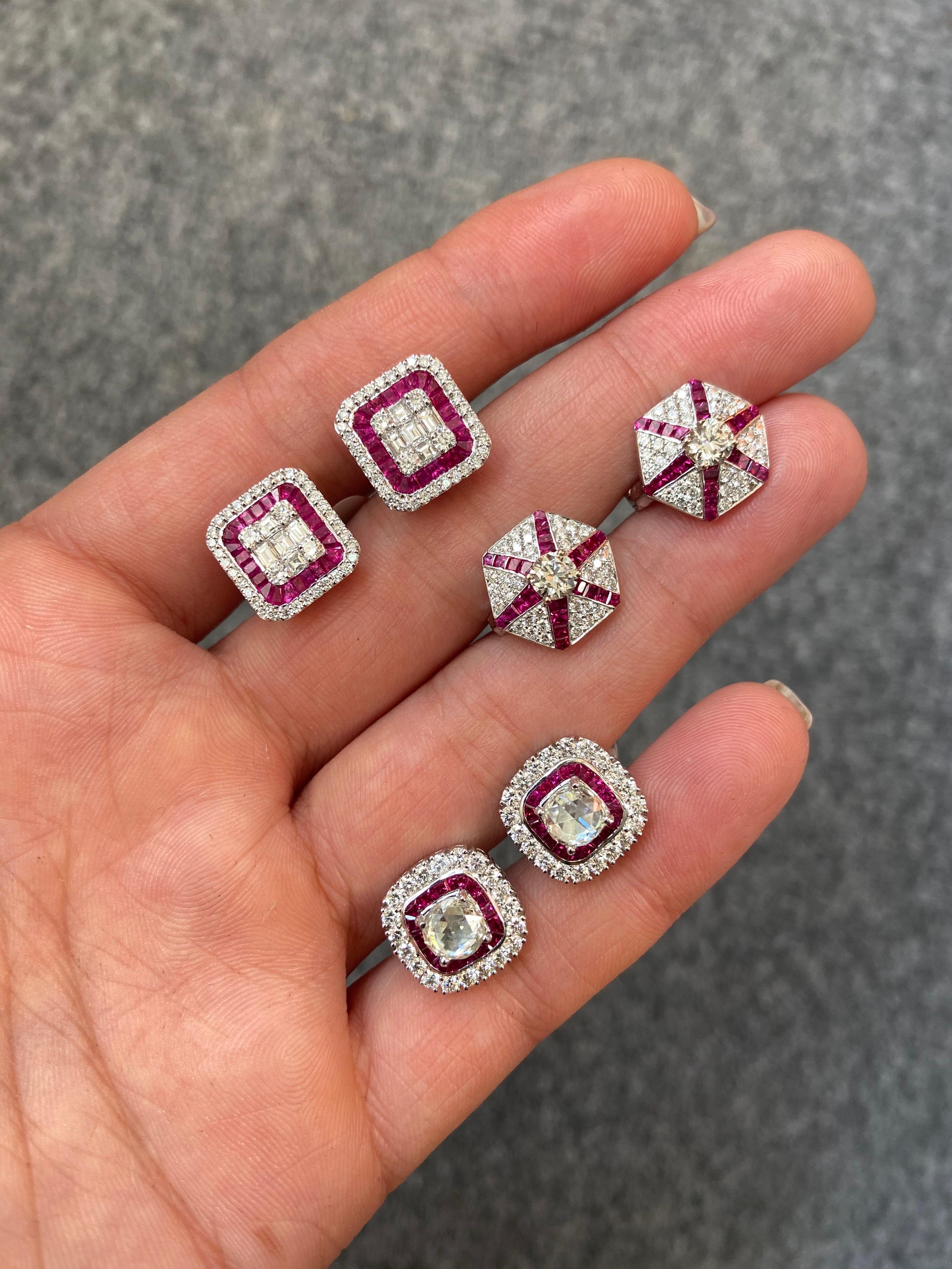 A classic pair of earrings, with illusion setting Diamonds (which look like 1 carat each) sorrounded by Ruby. A total of 1.10 carat VS quality, colourless, baguette and round Diamonds are used, and 2.71 carat Ruby, all set in solid 4.42 grams of 18K