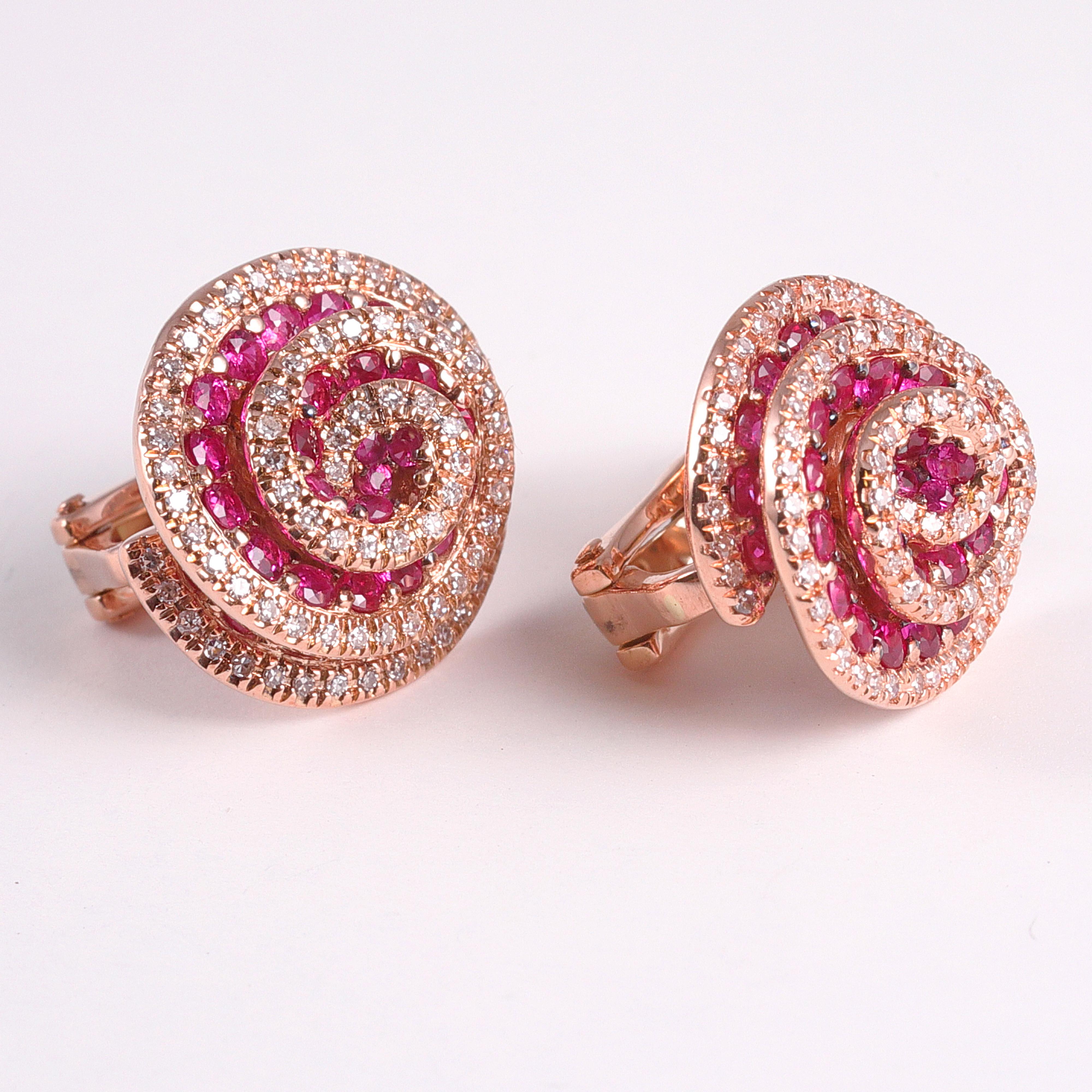 Delightful swirls of diamonds and rubies set in 14 karat rose gold by EFFY.  These earrings feature a french back for extra comfort and security.

