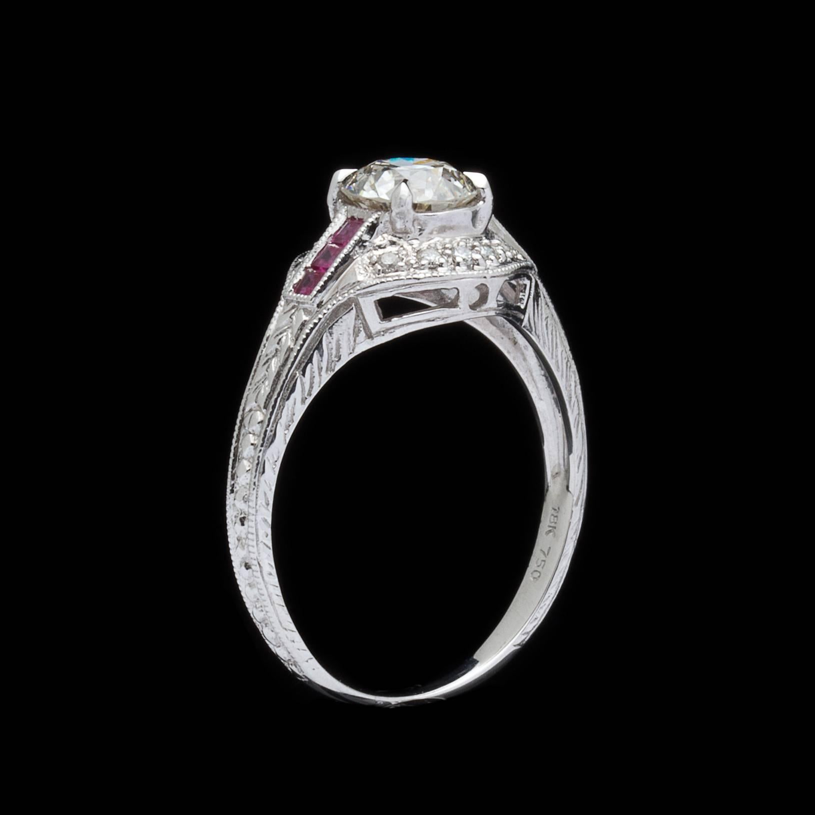 Featuring the details of classic hand engraved rings, this engagement ring centers a European-cut diamond weighing approximately 1.00-ct., with I color and VS2 clarity. The 18k white gold mounting is accented with square-cut rubies and 10 round