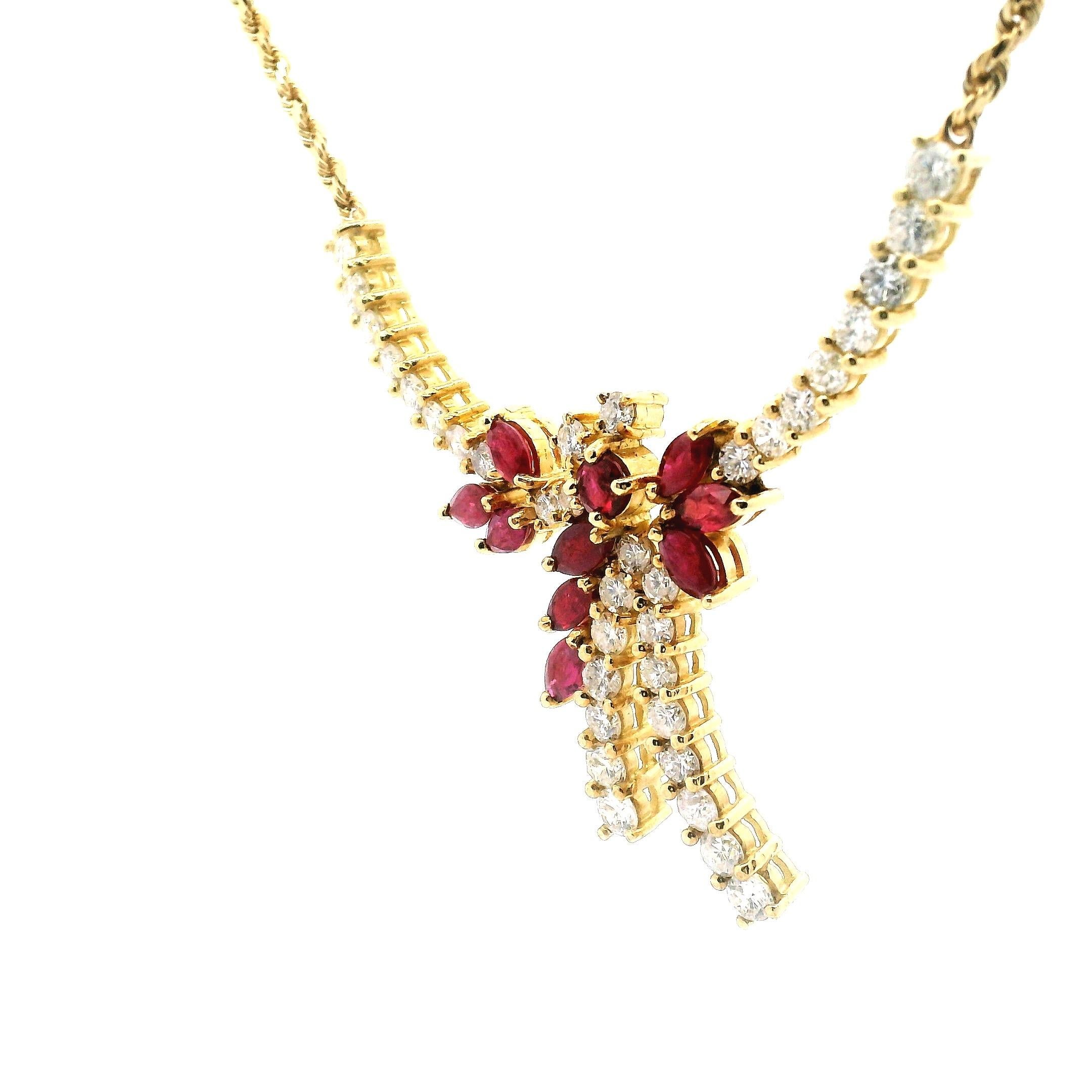 Diamond ribbon design with accented marque ruby pedals on a yellow gold rope chain. 18