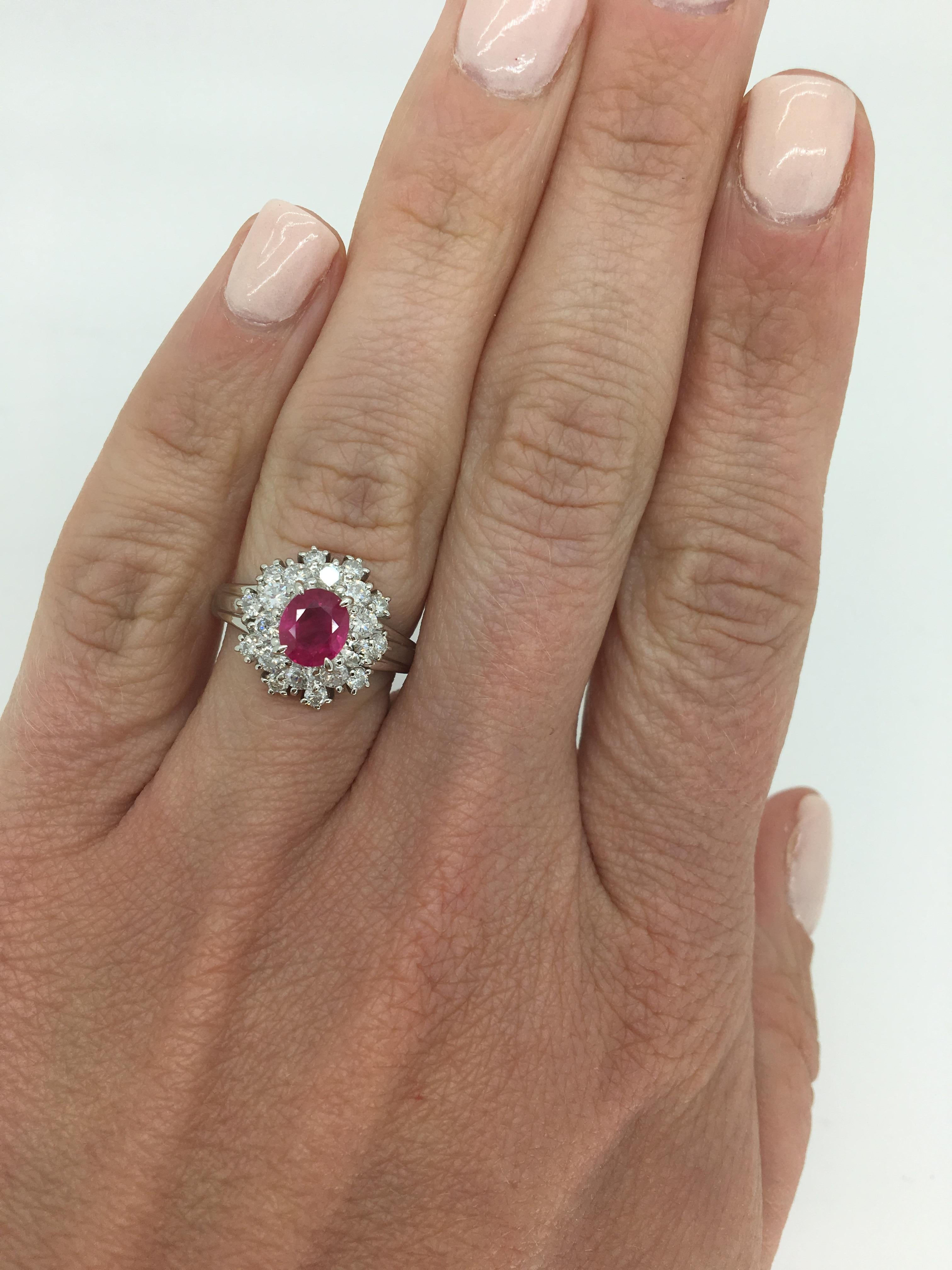 Halo style Ruby and Round Brilliant cut diamond ring crafted in platinum.

Gemstone: Ruby & Diamond
Gemstone Carat Weight: Approximately 1.01CT Ruby
Diamond Carat Weight:  Approximately .78CTW
Diamond Cut: Round Brilliant Cut
Color: Average