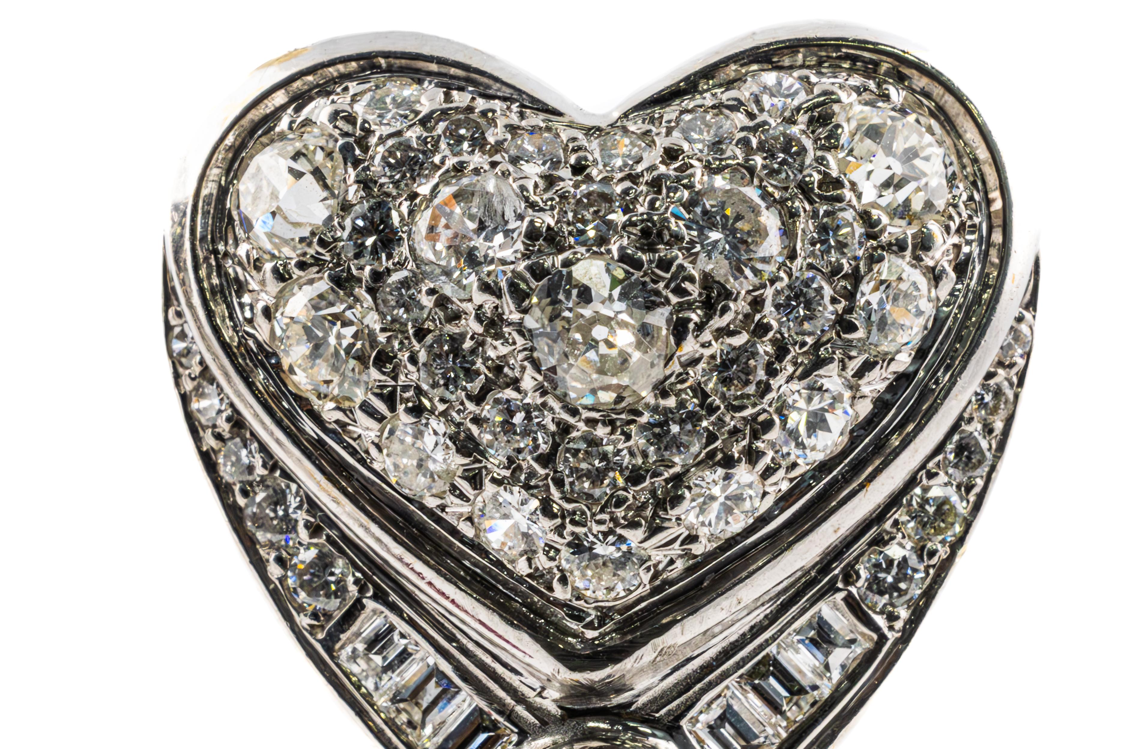 Diamond and Ruby Heart Drop Earrings in 14K White Gold

These majestic heart-shaped earrings embody romance and refinement, expertly crafted in 14K white gold. Each heart motif is adorned with a breathtaking array of pavé-set diamonds, further