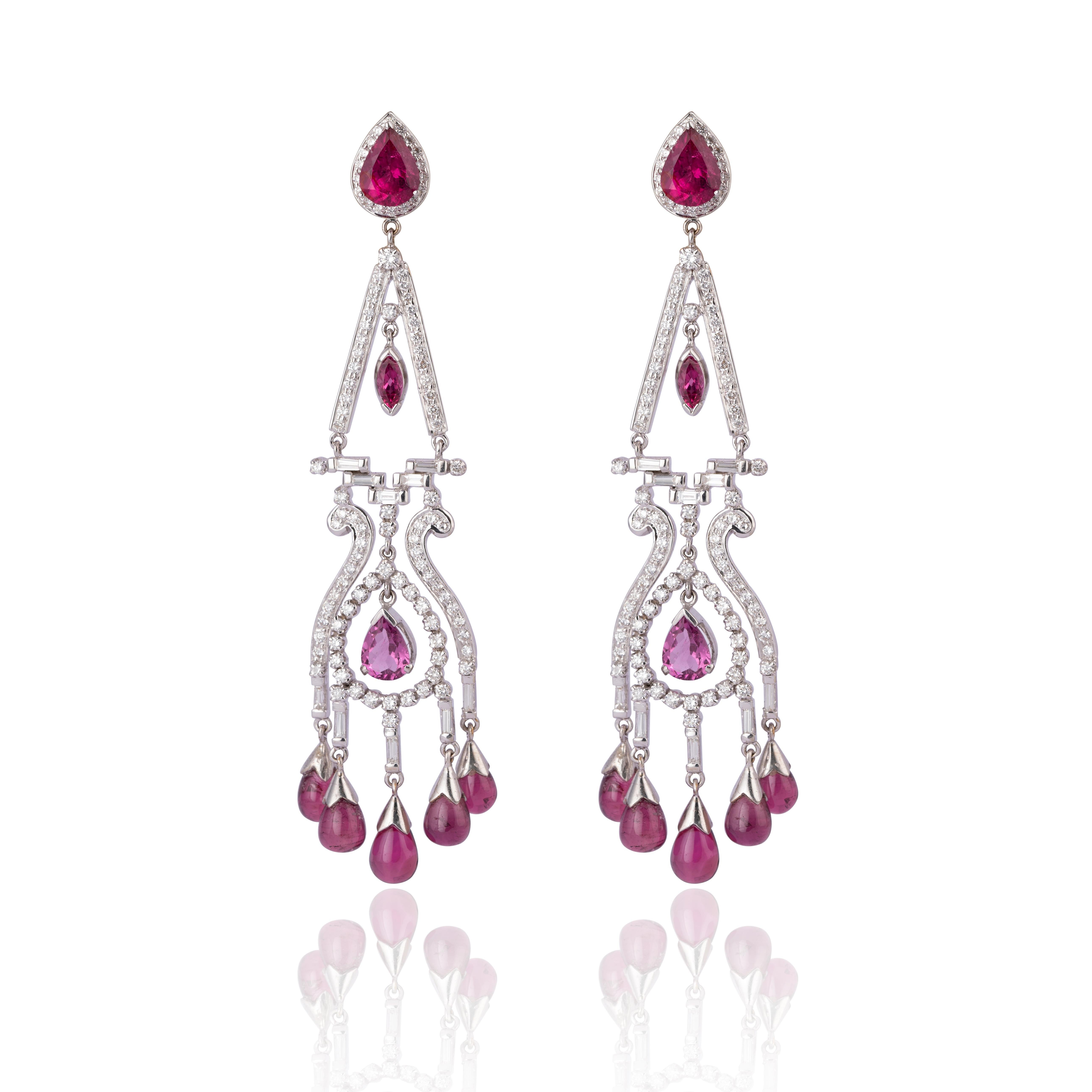 (Diamond 2.69 cts,) and (ruby light 21.58 cts ),(gold earring 18k nw 30.024gm)