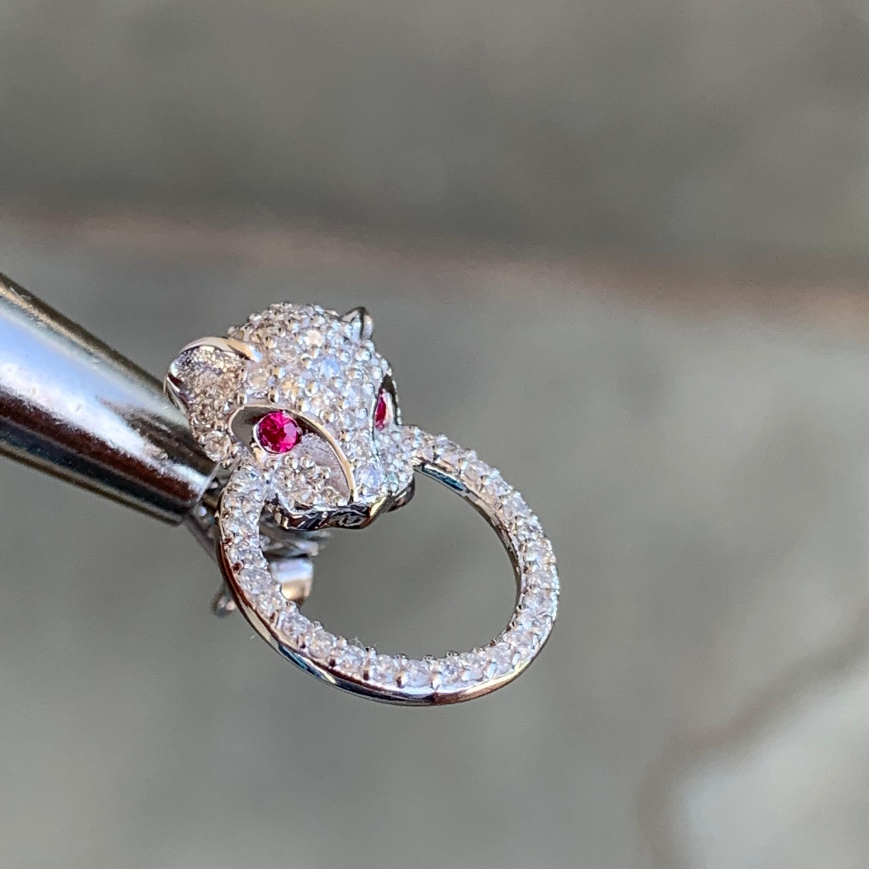 Made to order, please allow 1-3 weeks from date of final design approval by customer.  If you have a rush date you need them by let us know and we will let you know before if we can accommodate you.

Diamond and Ruby Panthere Studs

 0.46 ct