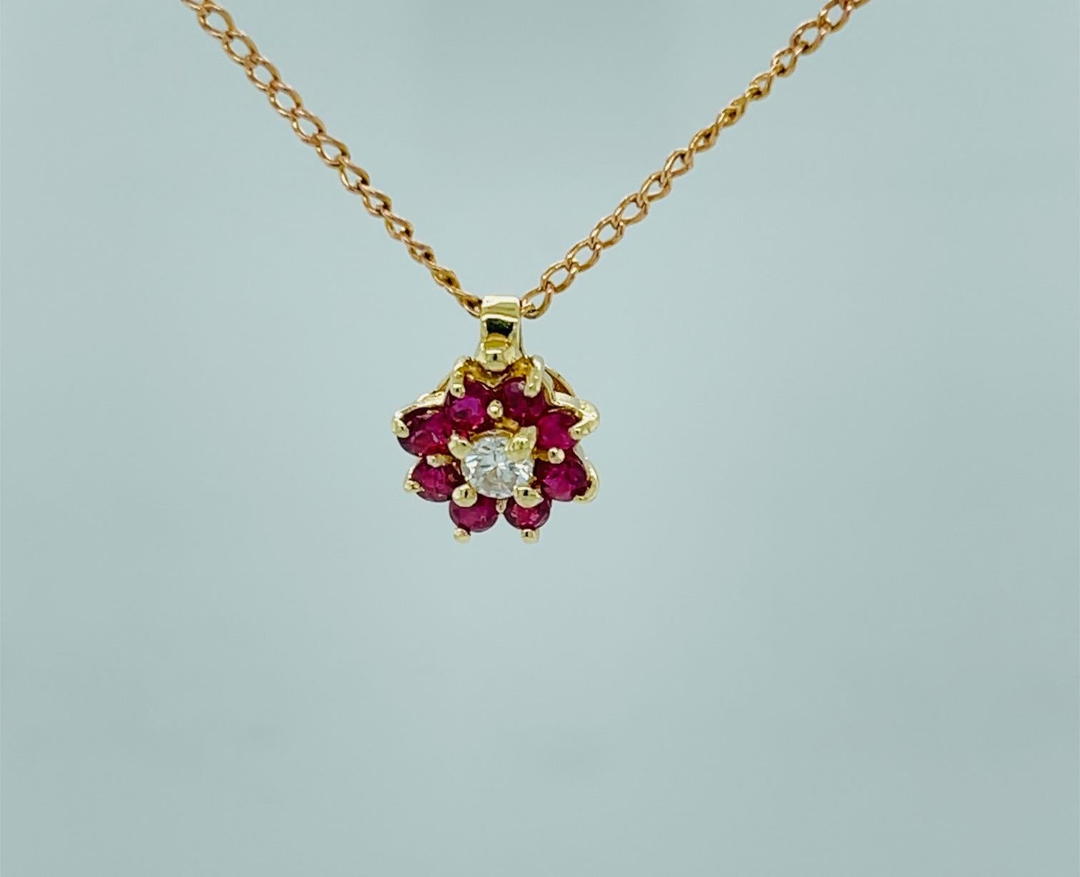 Diamond and Ruby Pendant 14K Yellow Gold

Round Diamond weighs 0.10 carat

F/G Color VS Clarity

Rubies Total carat weight 0.60 carat

With 16.0 