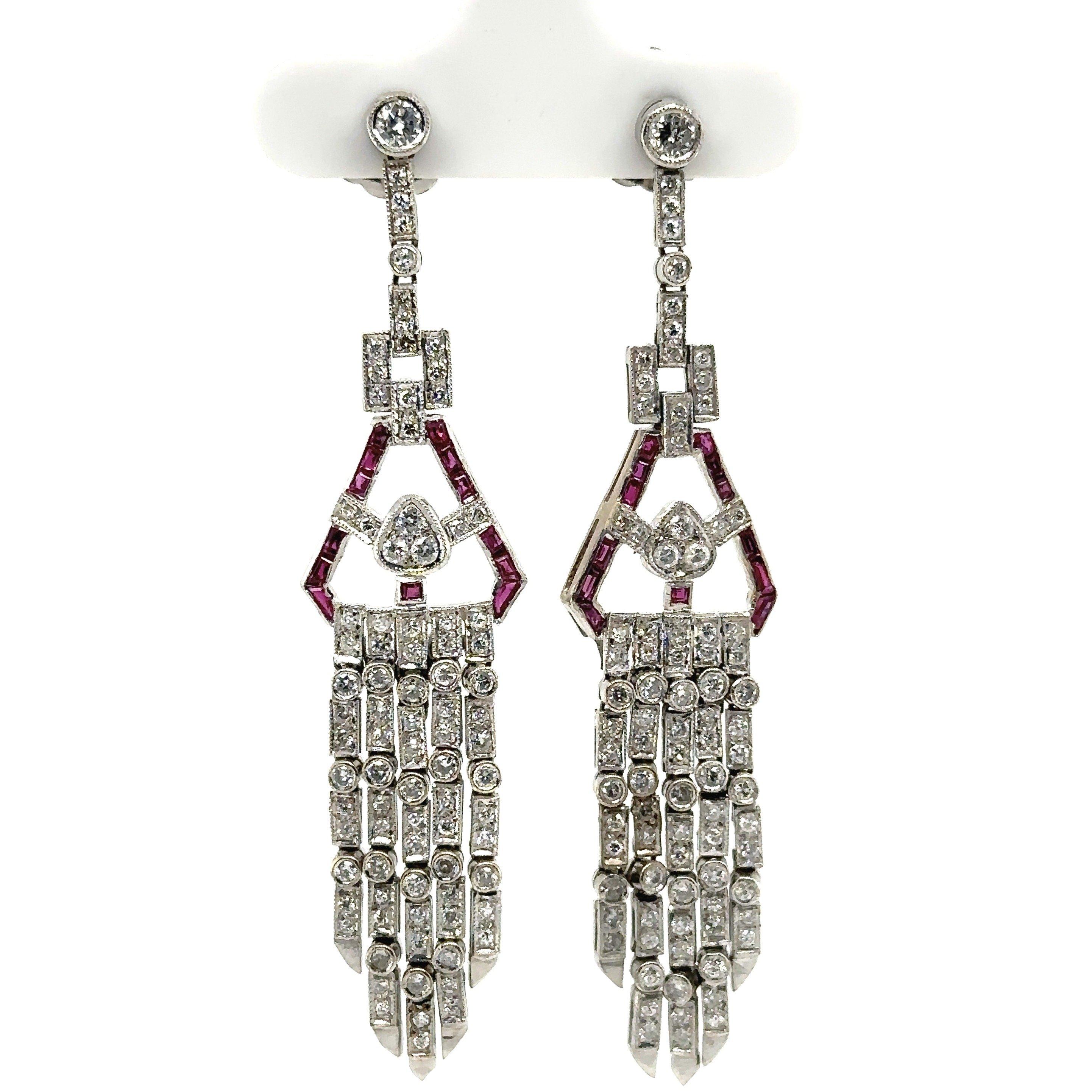 Stunning Pair of Art Deco Platinum Chandelier 1950's Earrings.
1.50ct Brilliant Round Diamonds.
F-H Color  VS-I Clarity.
.60ct Stunning Natural Red French Cut Rubies.
The Earrings are 2.5 Inches Long and a 1/2 Inches Wide. 
Weight 13 grams of