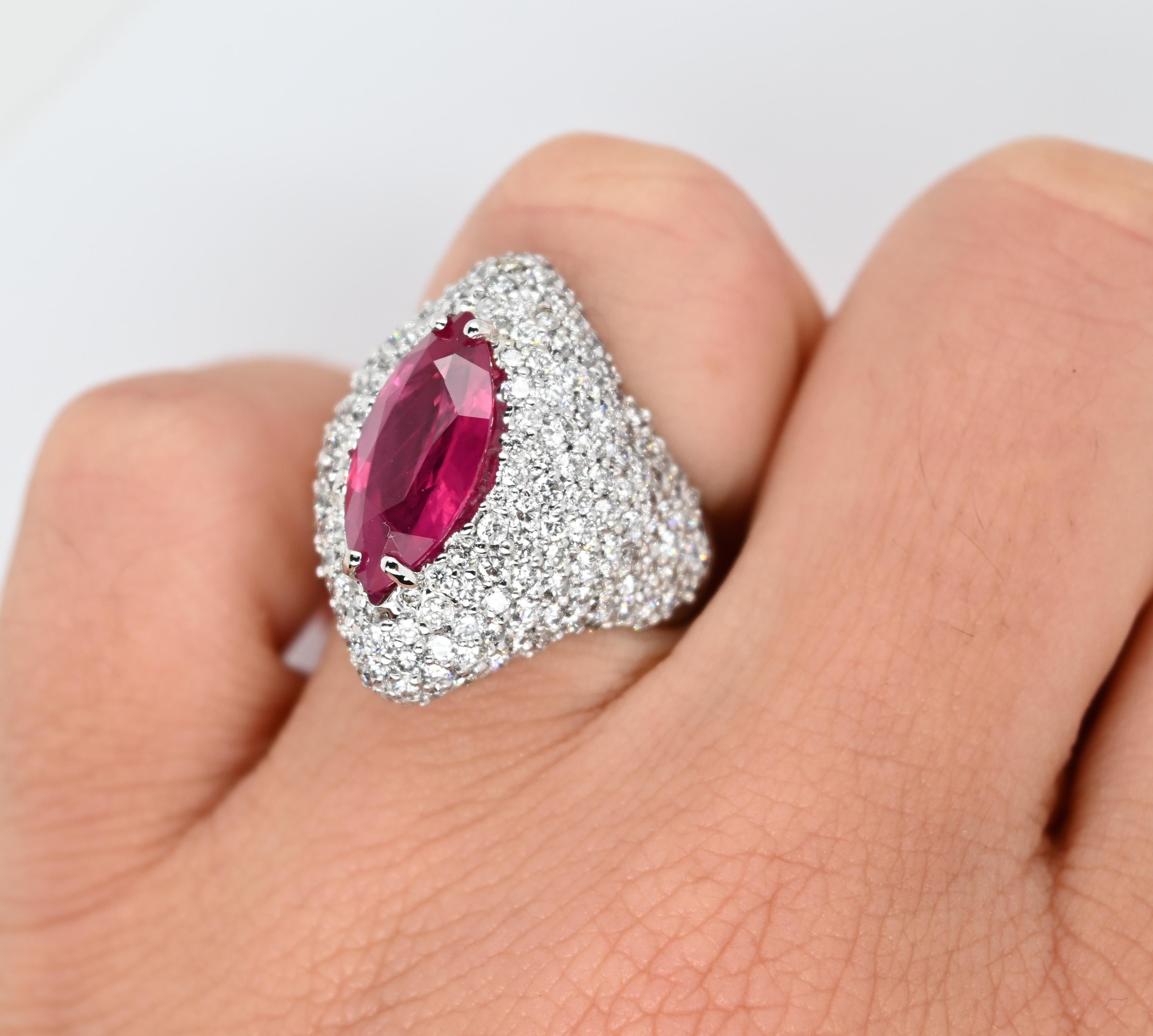Beautiful cocktail ring features 3.74 carats of round white diamonds and 3.94 carats of burma ruby.