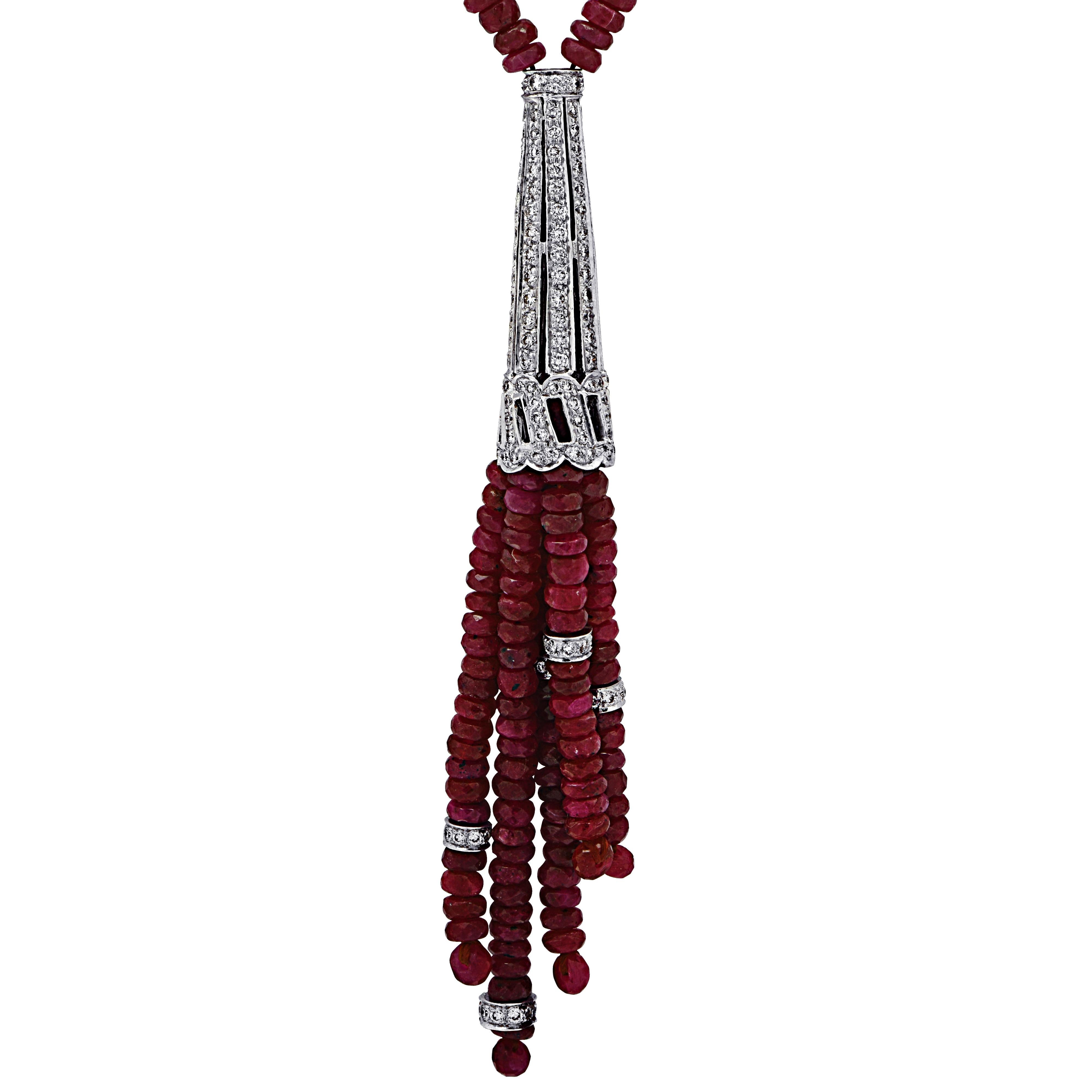 Stunning ruby and diamond tassel necklace featuring ruby briolettes accented with 223 round brilliant cut diamonds weighing approximately 3 carats total, G color, SI clarity, set in platinum. The deep hue of the rubies are accentuated by the crisp