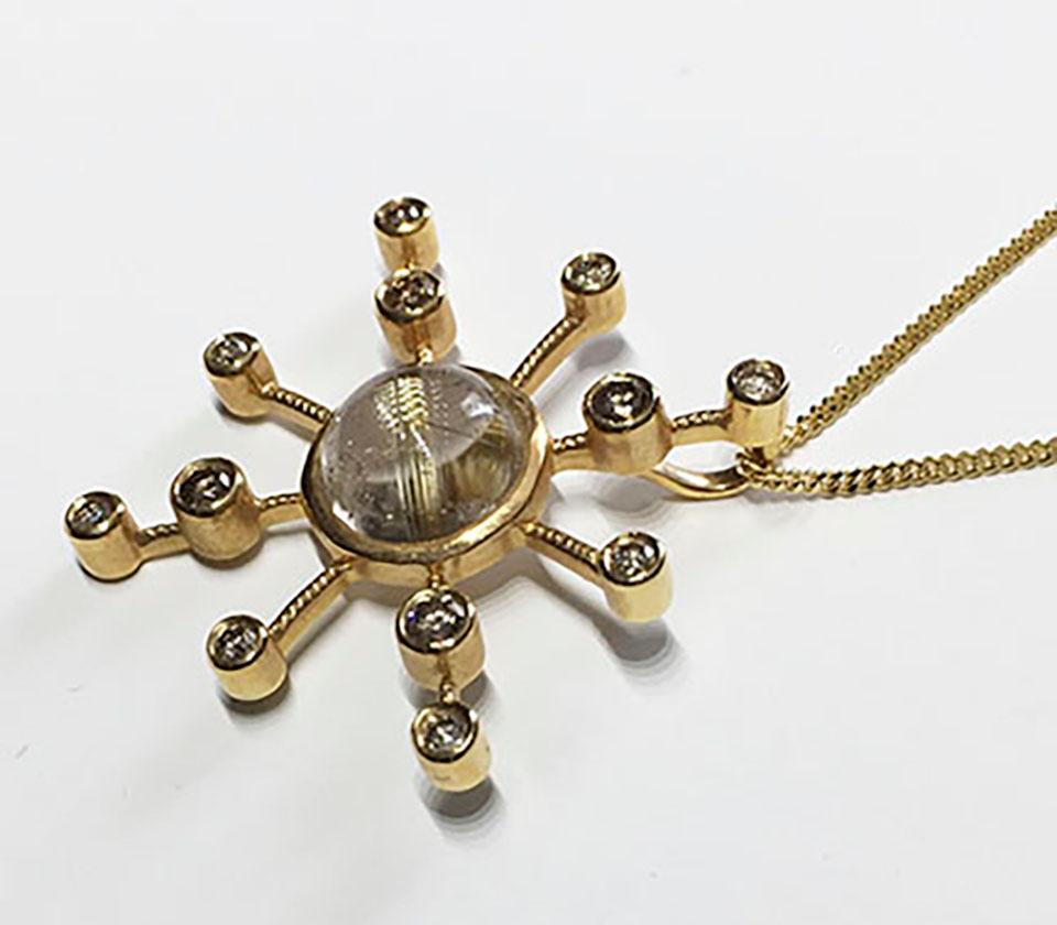 An 18k Yellow Gold Diamond Starburst Pendant set with Rutillated Quartz For Sale 5