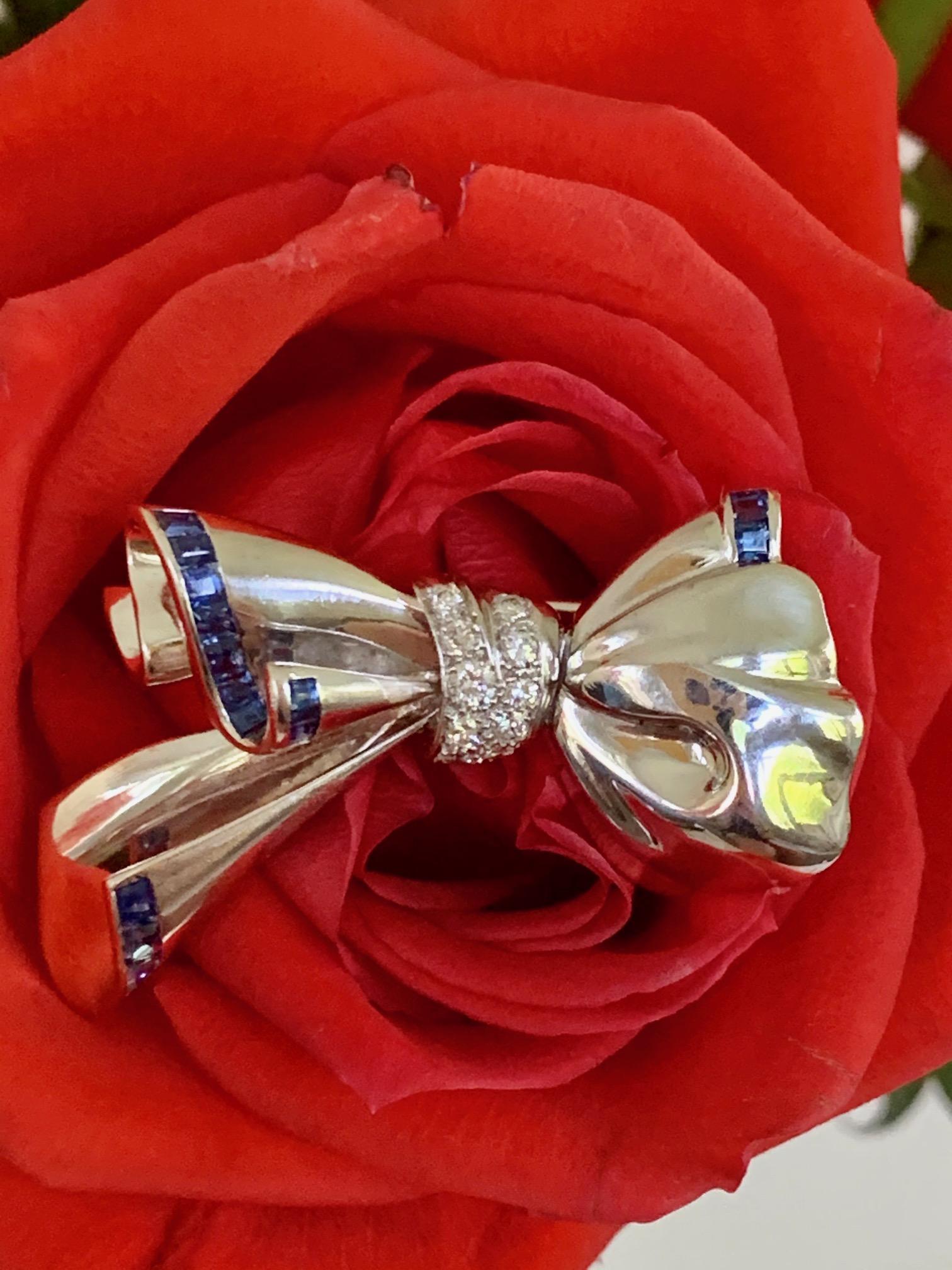 This is a must have beautiful statement brooch.  It is from the 1940's.

It is stamped 18k.
It is engraved 