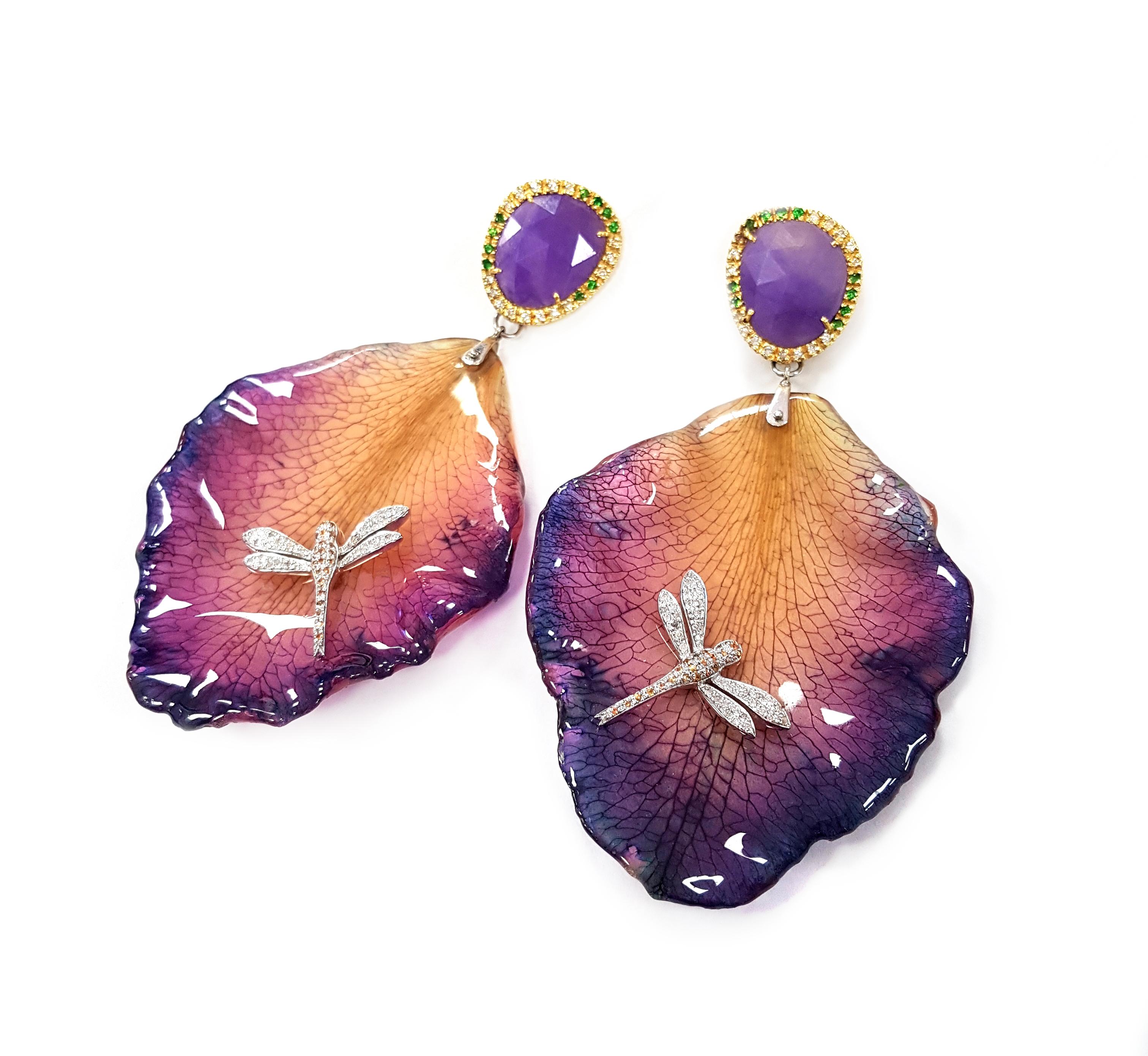 A vibrant pair of floral earrings masterfully created entirely by hand. Each earring features a perfect petal from a real orchid, which has been transformed to preserve its beauty for eternity. The orchid petals are approximately 4.7 centimetres