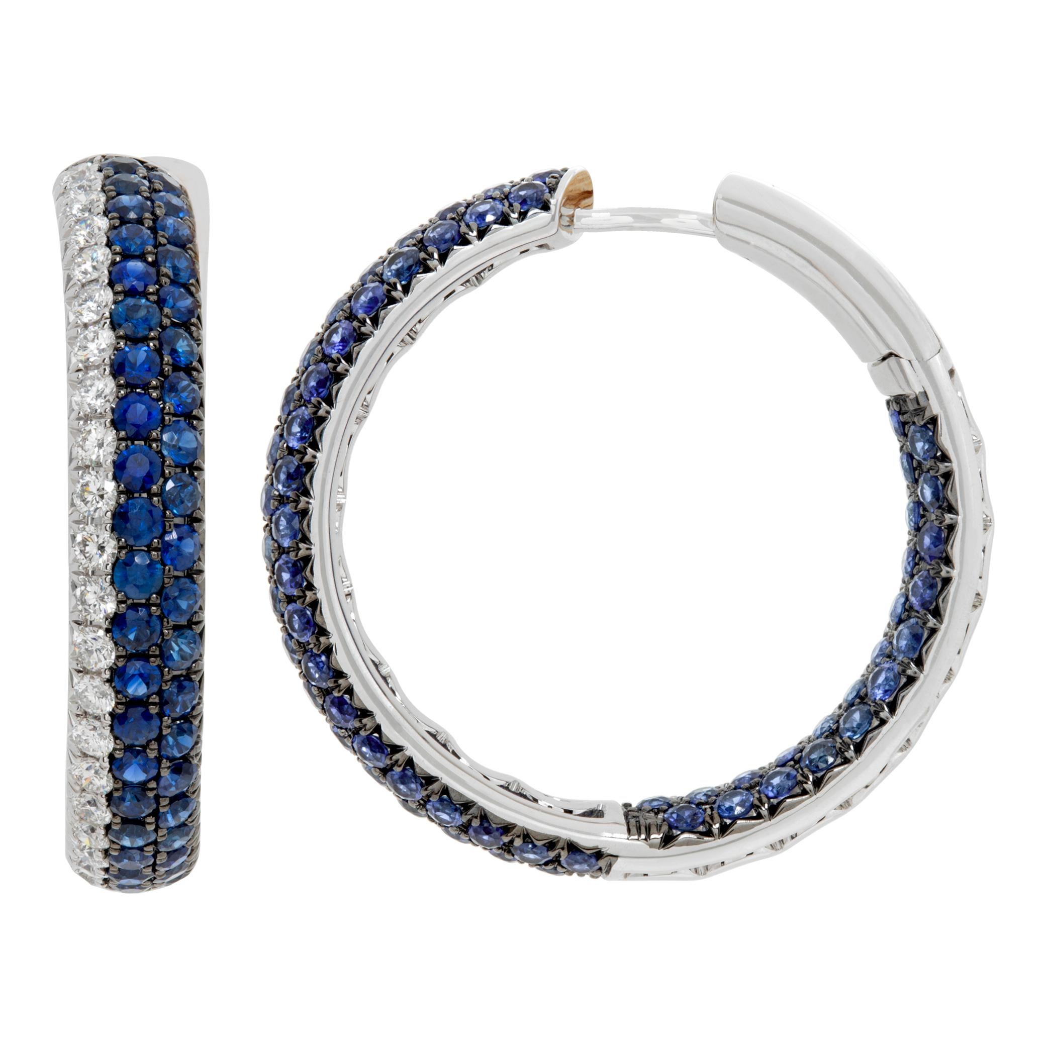 Inside-out hoops in 18k white gold with 1.73 carats in round brilliant cut diamonds (G-H Color, VS Clarity) and 4.17 carats in deep blue round sapphires. 30mm diameter.