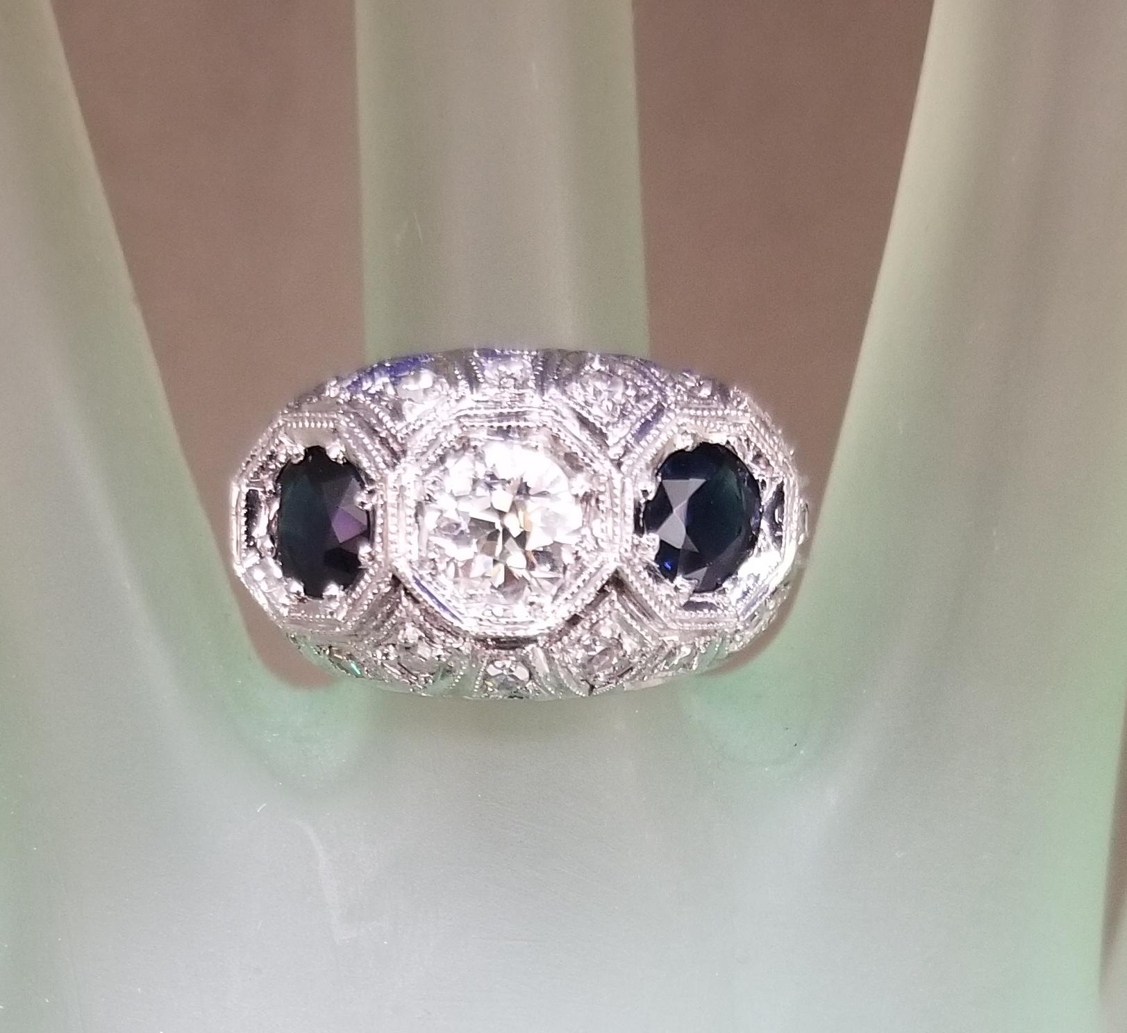 14k white gold ladies diamond and sapphire ring, containing 1 