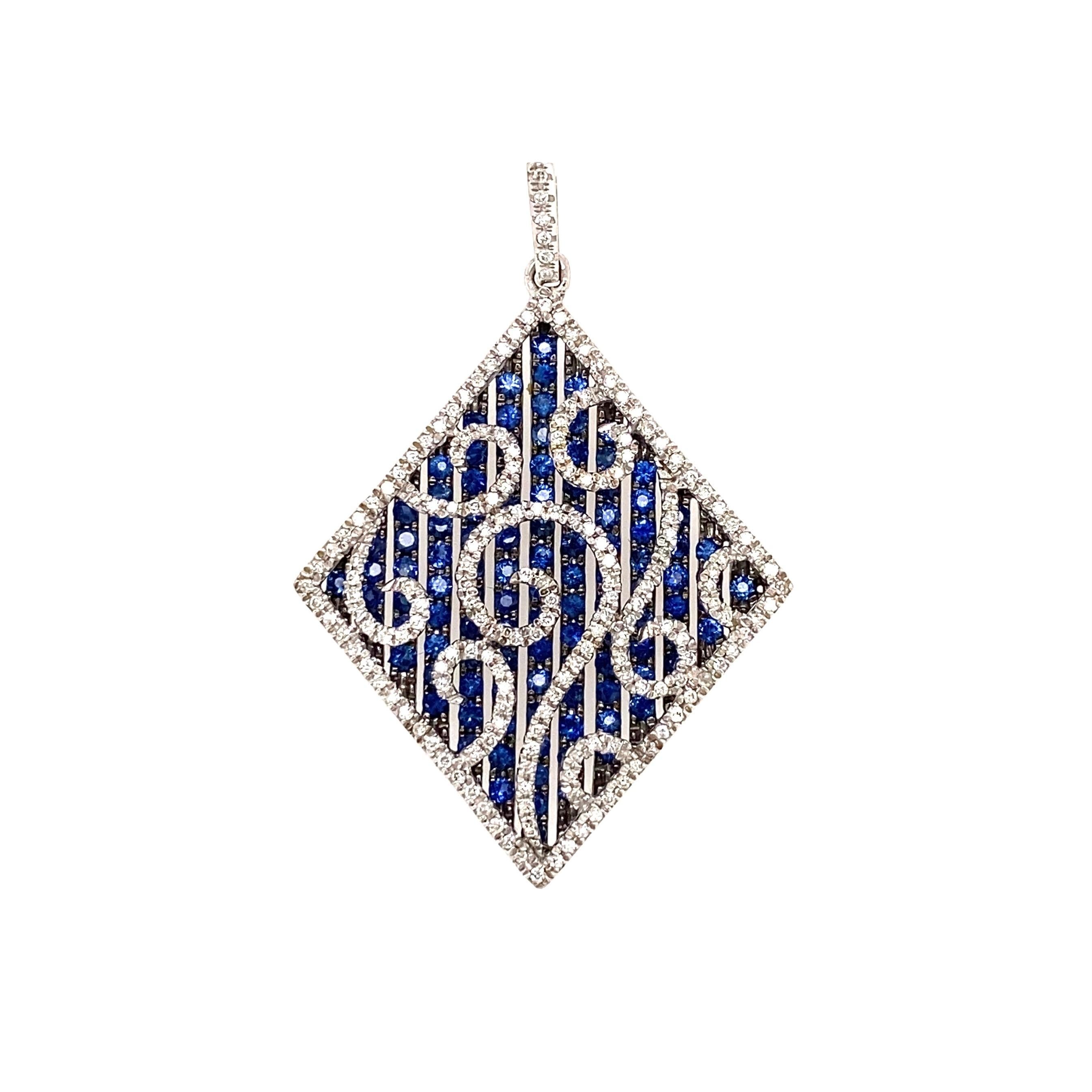 Simply Beautiful! Diamond and Sapphire Pendant. Pave Hand set Round Brilliant-cut Diamonds, weighing approx. 1tcw; H color, SI1-SI2, Clarity and Sapphires approx. 2tcw. Hand crafted 14K White Gold mounting. Pendant measures approx. 1.70” L x 1.25”