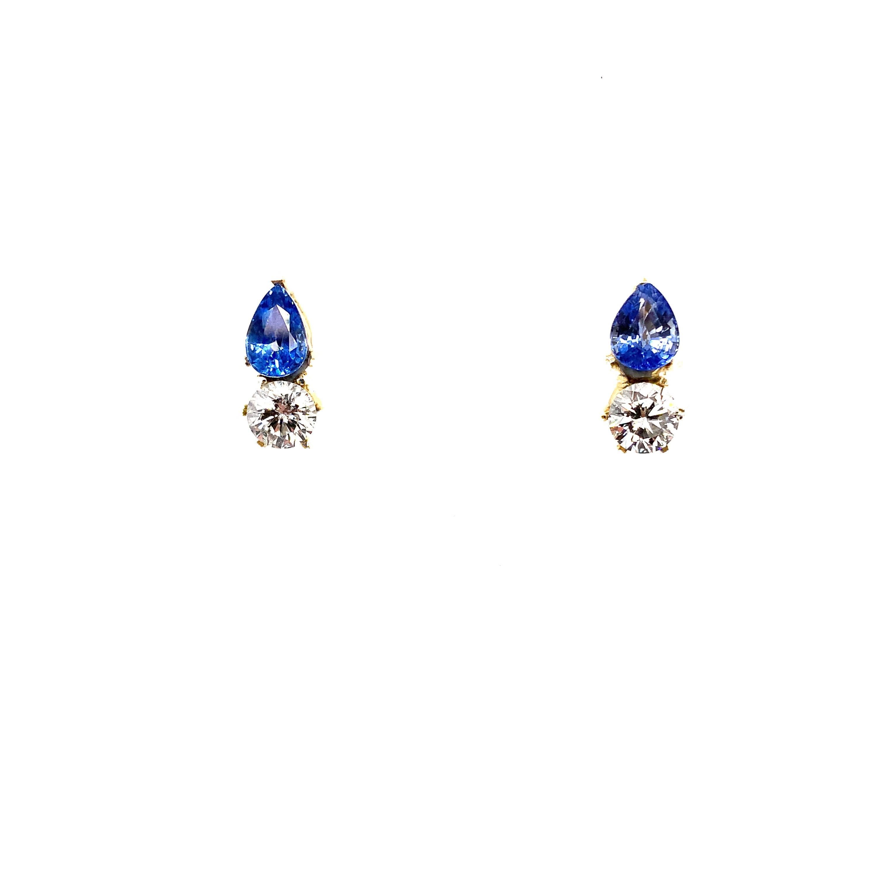 Diamond and sapphire stud earrings 18k yellow gold 
Blue sapphire pear shaped gemstone natural untreated total weight 1.20ct
Art deco blue sapphire and diamond stud earrings 18k yellow gold 
Round diamond G colour VS1 clarity 1.21ct 
Hallmarked,