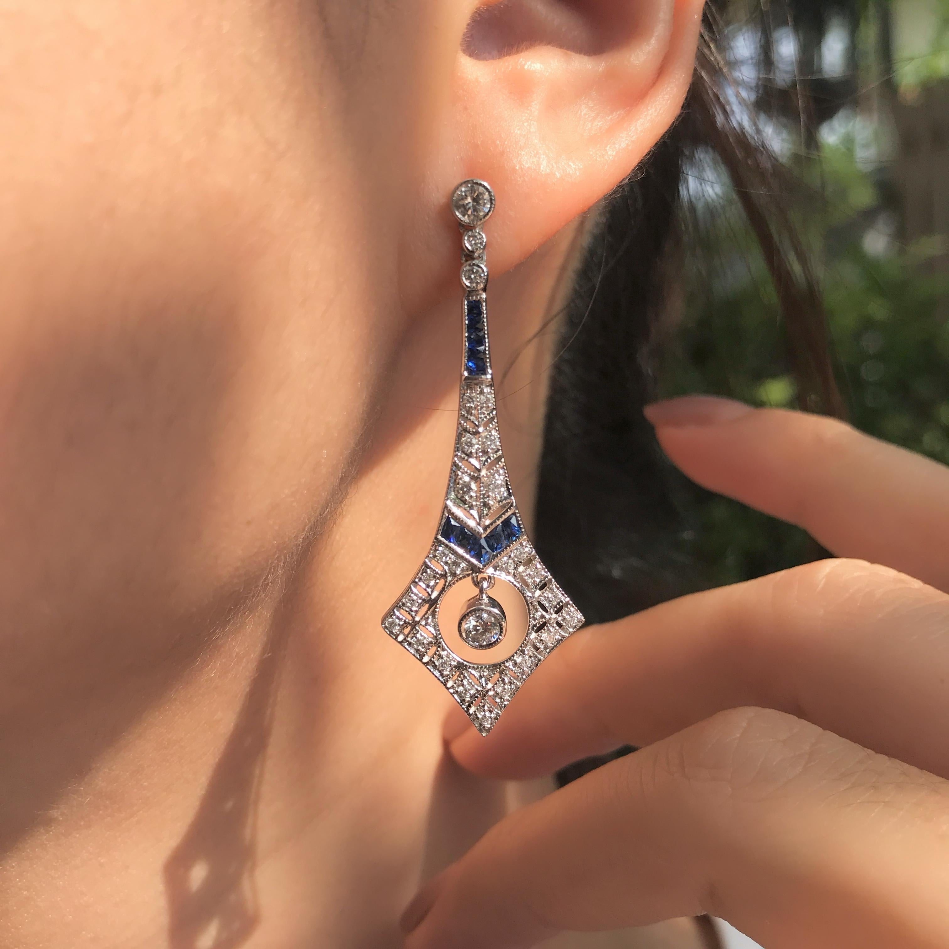 Featuring exquisite round diamonds with stunning French-cut sapphires, these earrings showcase a captivating design. The sapphire is elegantly set above a round diamond, creating a beautiful contrast that draws attention. Perfect for special