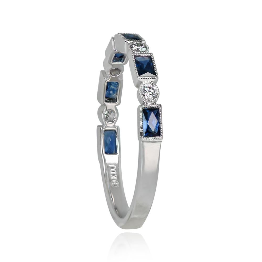 A stunning half-eternity band showcasing bezel-set French-cut baguette natural sapphires and round brilliant cut diamonds. Fine milgrain detail surrounds the bezels. Crafted in platinum.

Ring Size: 6.5 US, Resizable
Metal: Platinum
Stone: Diamond,