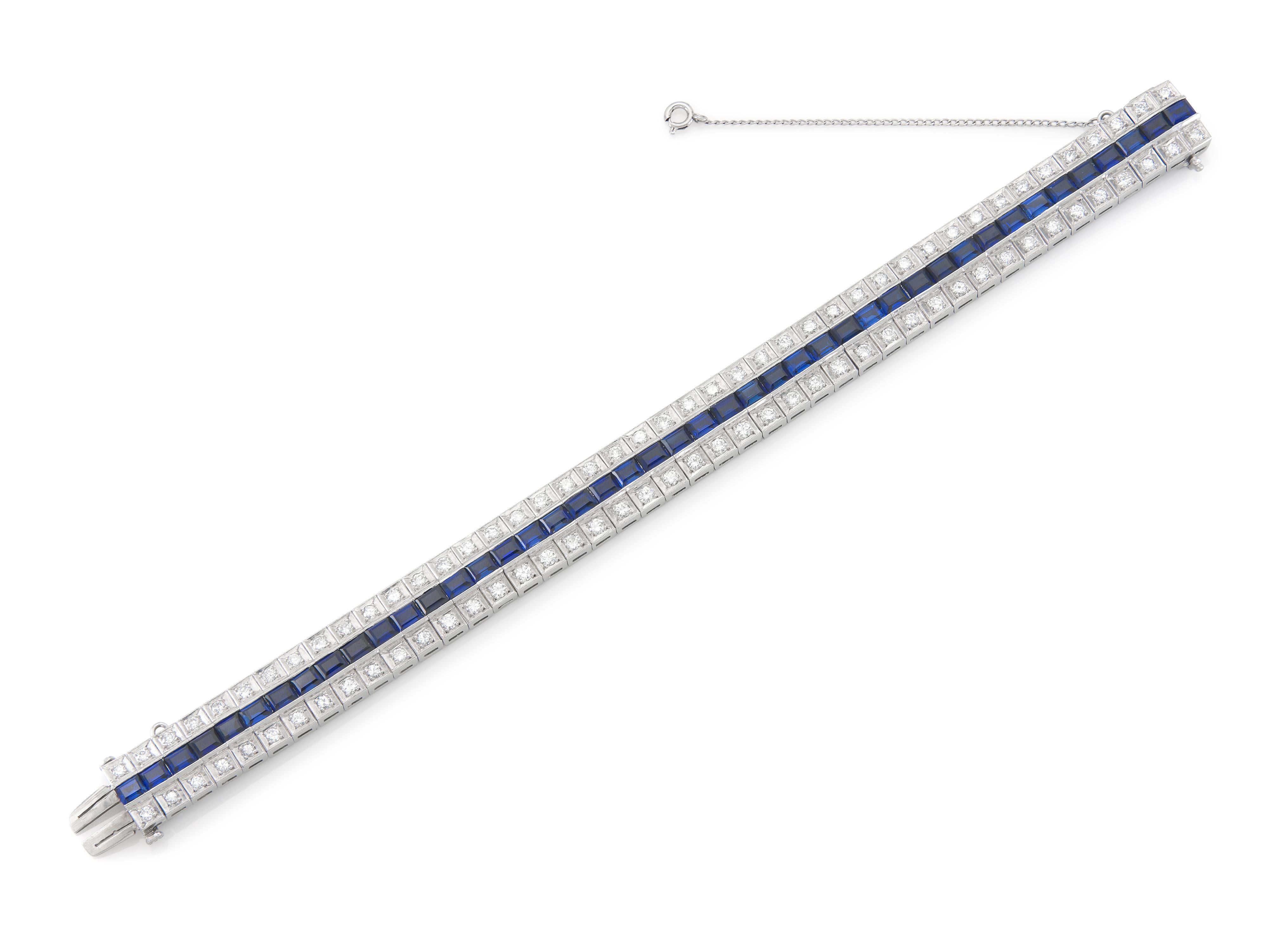Finely crafted in platinum with Round Brilliant cut Diamonds weighing approximately a total of 5.00 carats and Rectangular cut synthetic Sapphires.
Size 7 inches, 3/8 inch wide