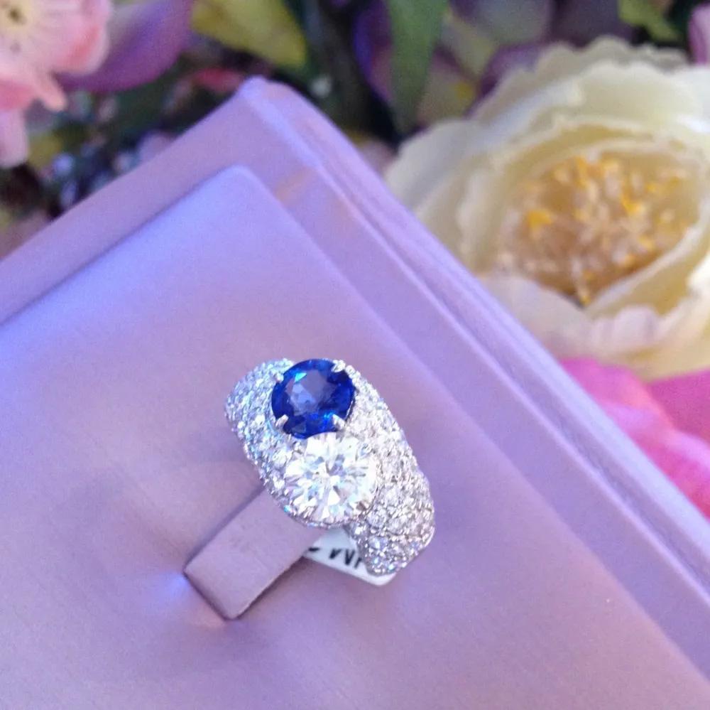 1.13 Carat Diamond and 1.08 Carat Sapphire Bypass Pavé  Ring 2.81 Carats total weight in 18k White Gold

Beautiful Bypass Ring features 2 Center stones both Prong-set: a 1.13 carat Round Brilliant cut Diamond and a 1.08 carat lively Round Blue