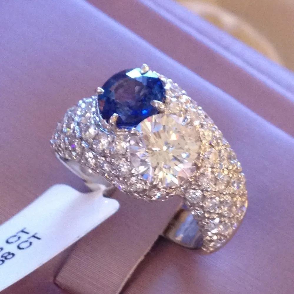 Round Cut Diamond and Sapphire Bypass Pavé Ring in 18k White Gold For Sale