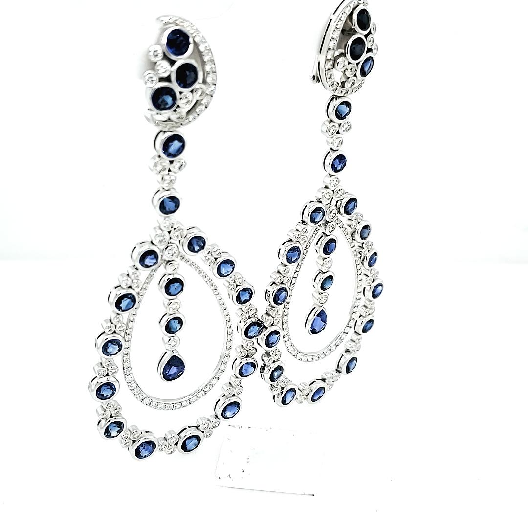18K White Gold Dangle Earrings with 17.82 carats of Sapphires and 3.69 of fine quality white round diamonds. 
