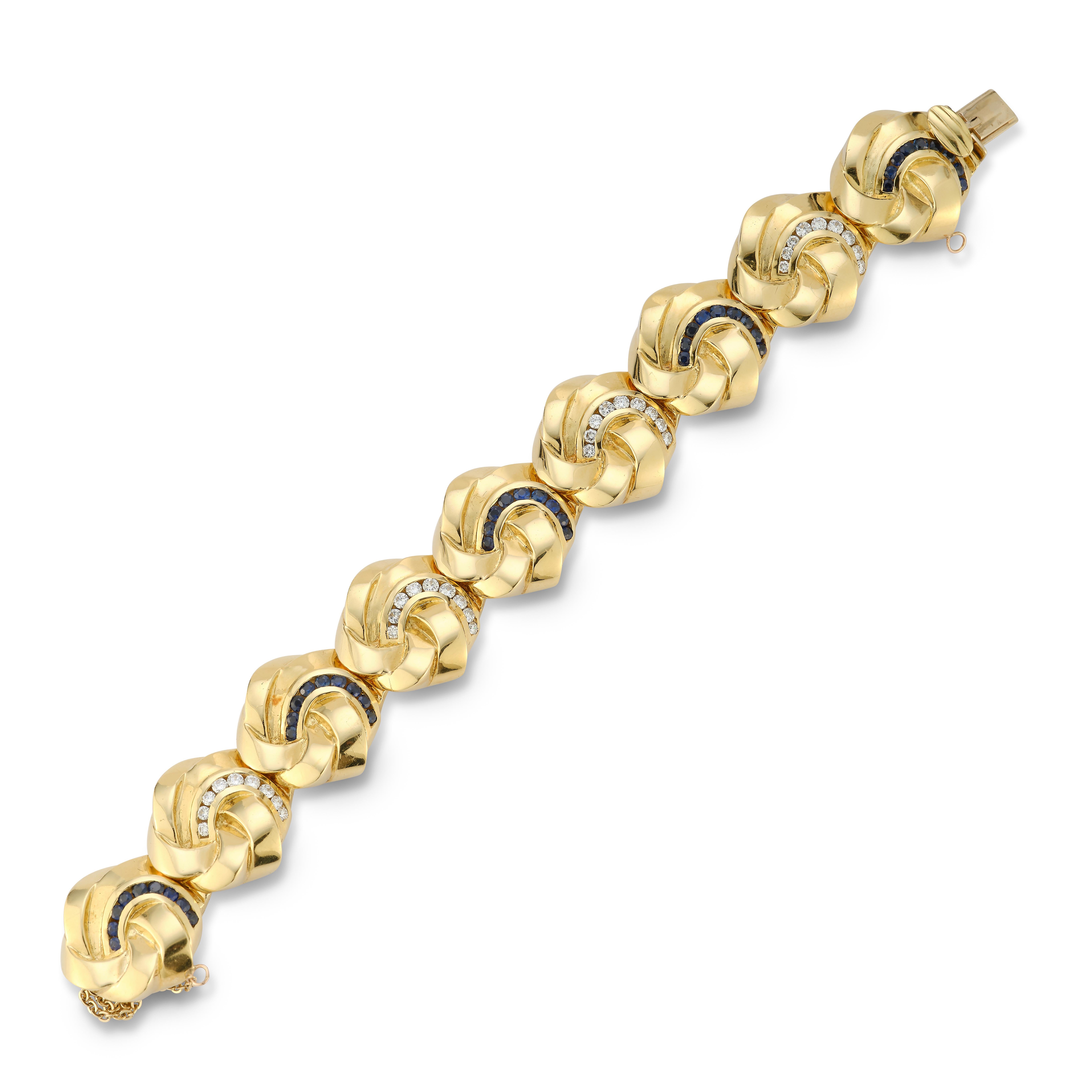 Diamond & Sapphire Gold Bracelet with safety lock
Gold Type: 14K Yellow Gold
36 diamonds, approx 1.5 cts
45 Sapphires
82.9 Grams
Measurements: 7.5