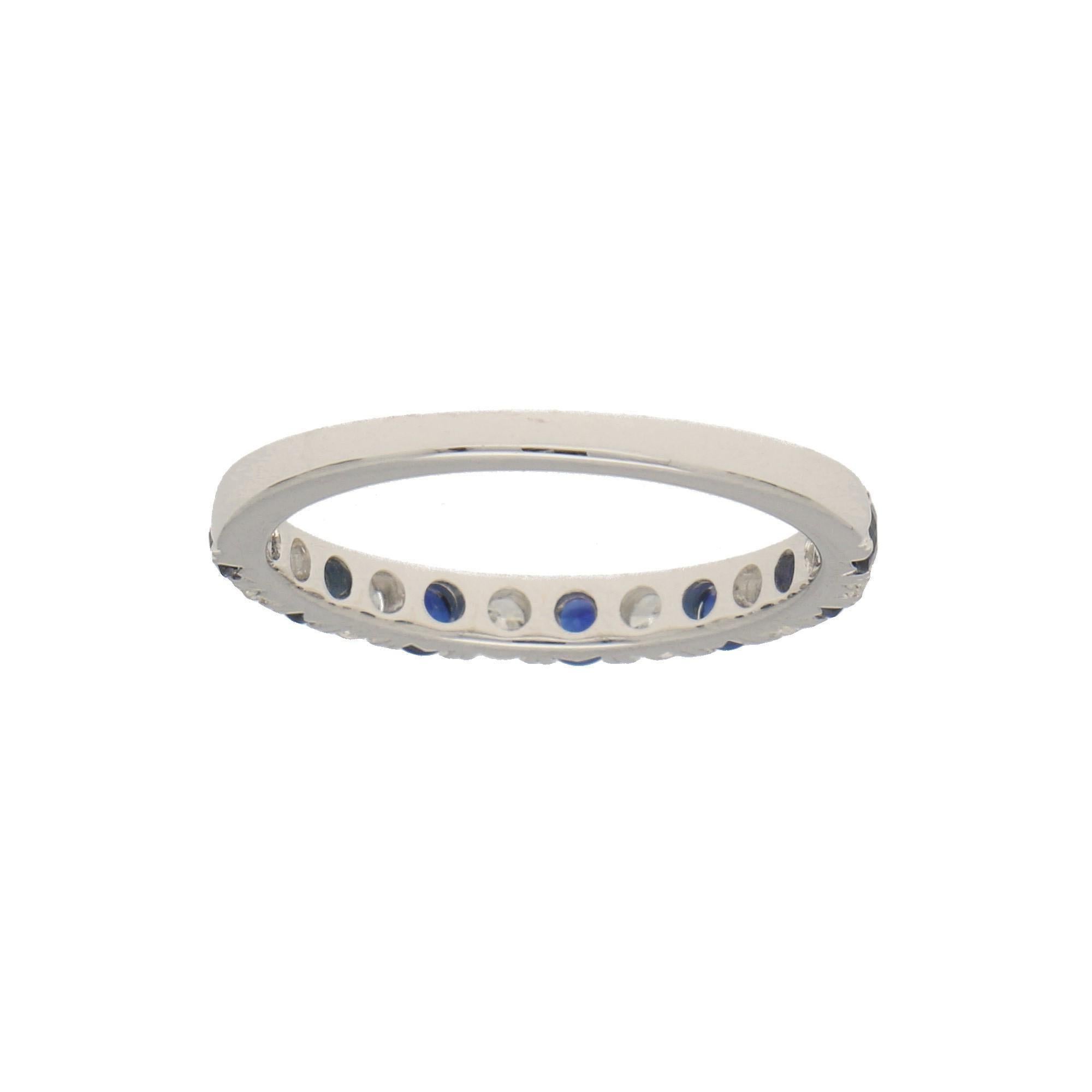 A beautiful diamond and sapphire half eternity ring set in 18k white gold. The ring is composed of 13 round brilliant cut stones altogether, 7 of which being sapphires and 6 diamonds. All the stones are perfectly set within a 2mm white gold