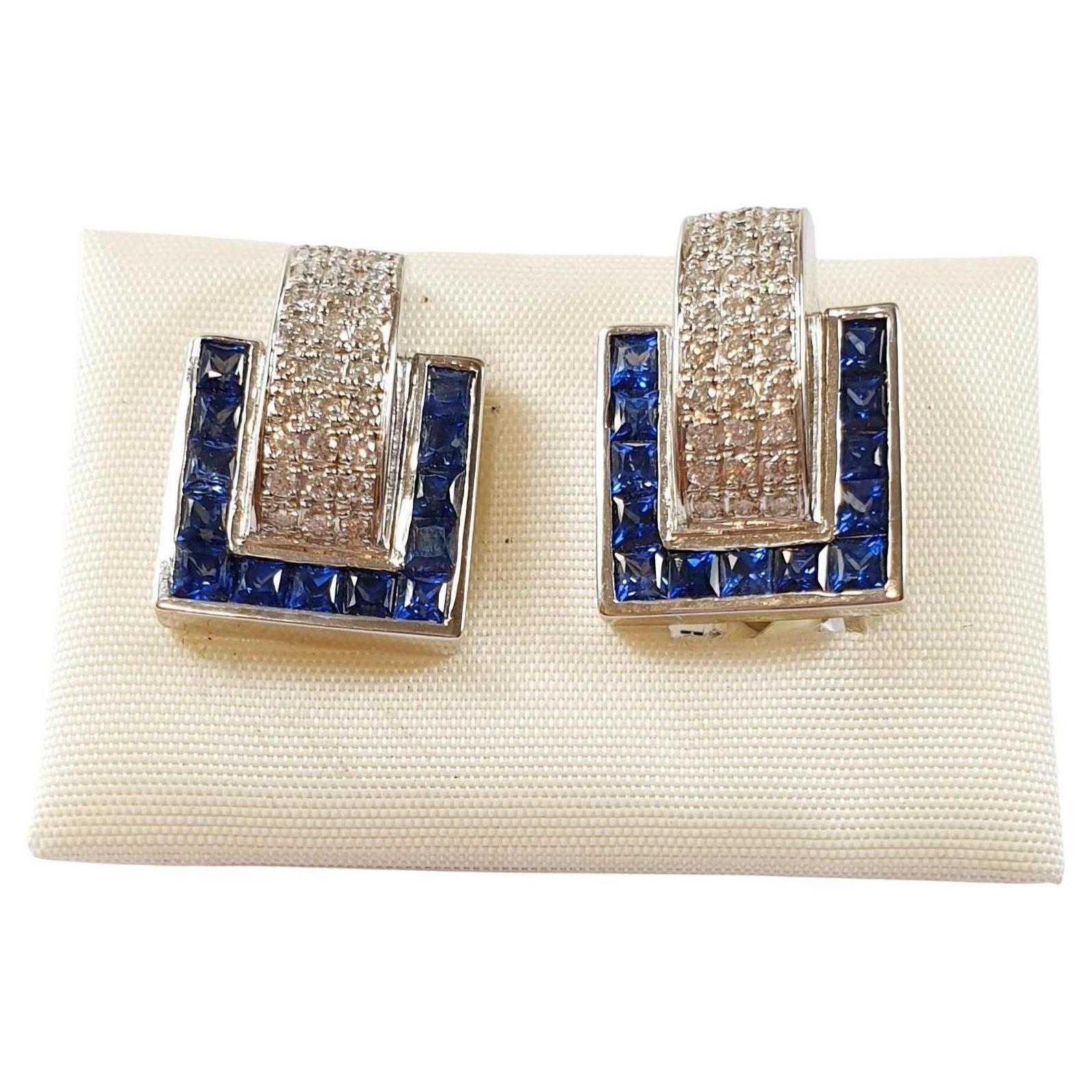 Diamond and Sapphire Hoops Earrings in 18 Karat White Gold 
These pair of 18k white gold hoops earrings weight 5,,7grams each and have o.28ct of diamonds 
Please note that carat weights may slightly vary as each Irama Pradera Jewels creation is