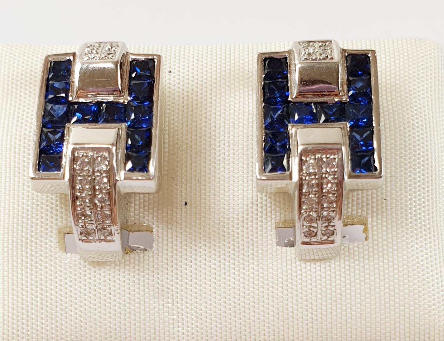 Diamond and Sapphire Hoops Earrings in 18 Karat White Gold with a H Hermes Horseshoe design
These pair of 18k white gold hoops earrings weight 6,2 grams each and have o.28ct of diamonds 
Please note that carat weights may slightly vary as each Irama