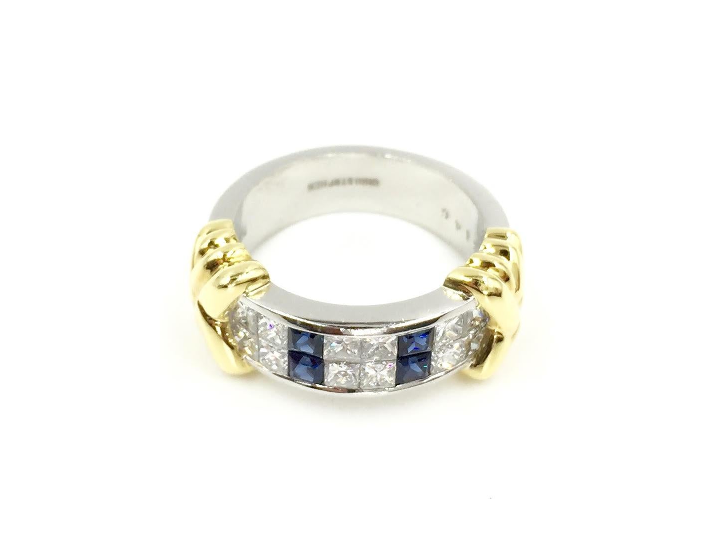 A great find for a sleek and sophisticated wide band. Perfect for every day wear as a right hand ring or wedding band. Made by Christopher Designs using .46 carats of high quality vibrant square blue sapphires and 1.07 carats of white brilliant